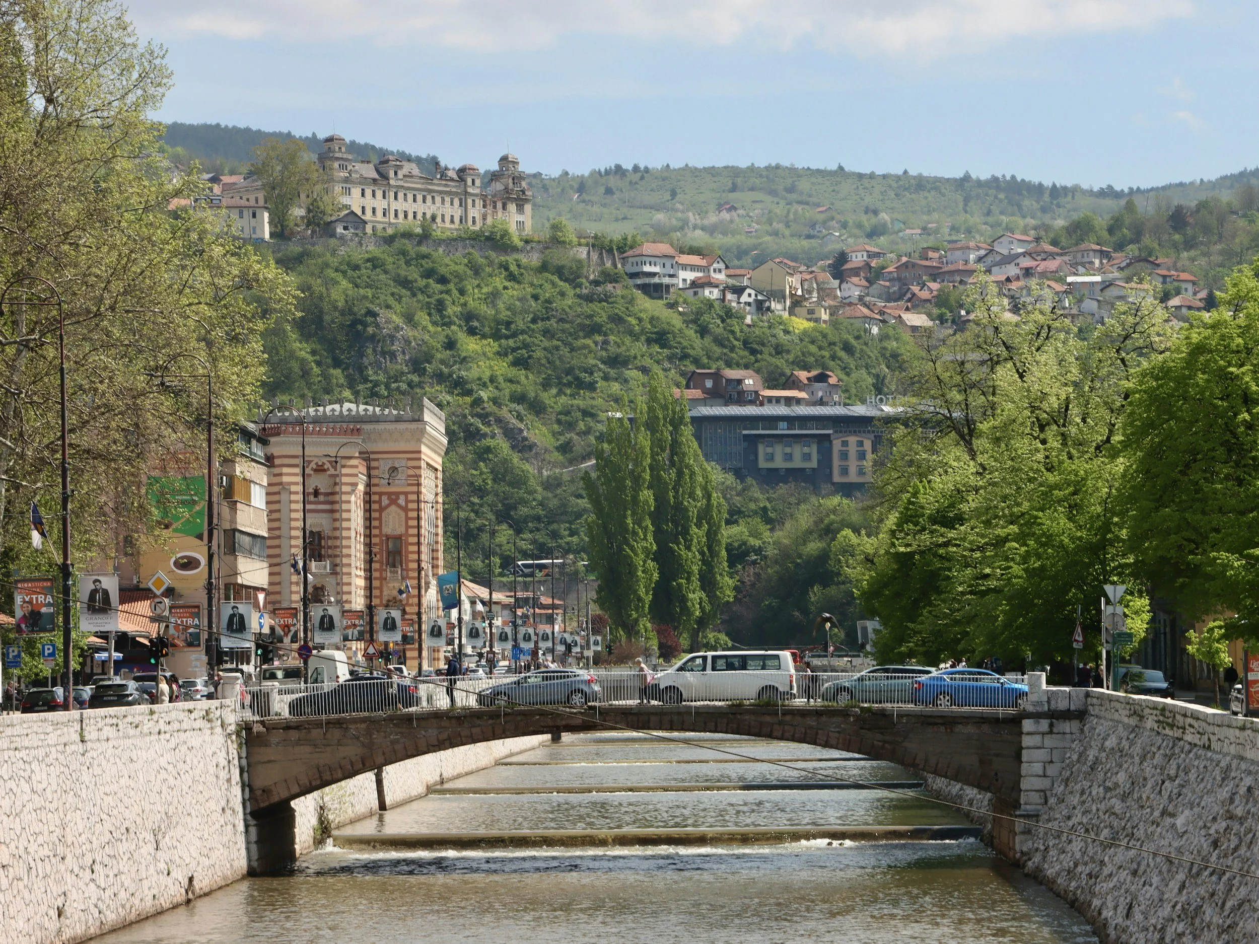 river and hills houses green