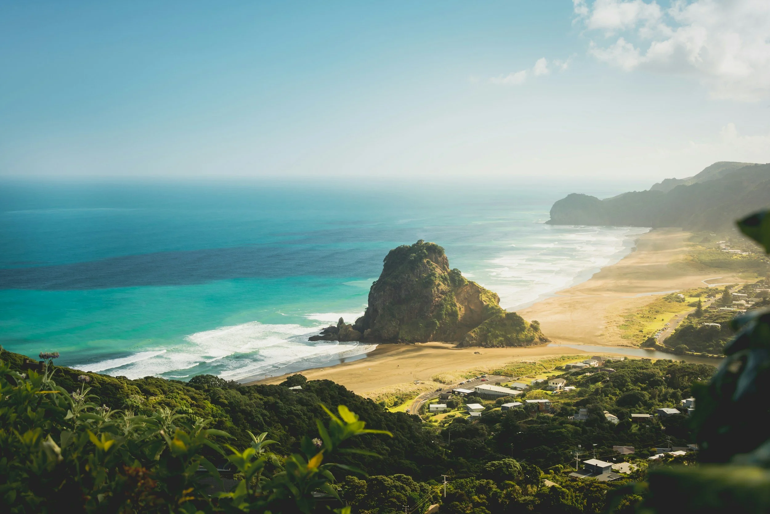 rocky cliff and beach new zealand