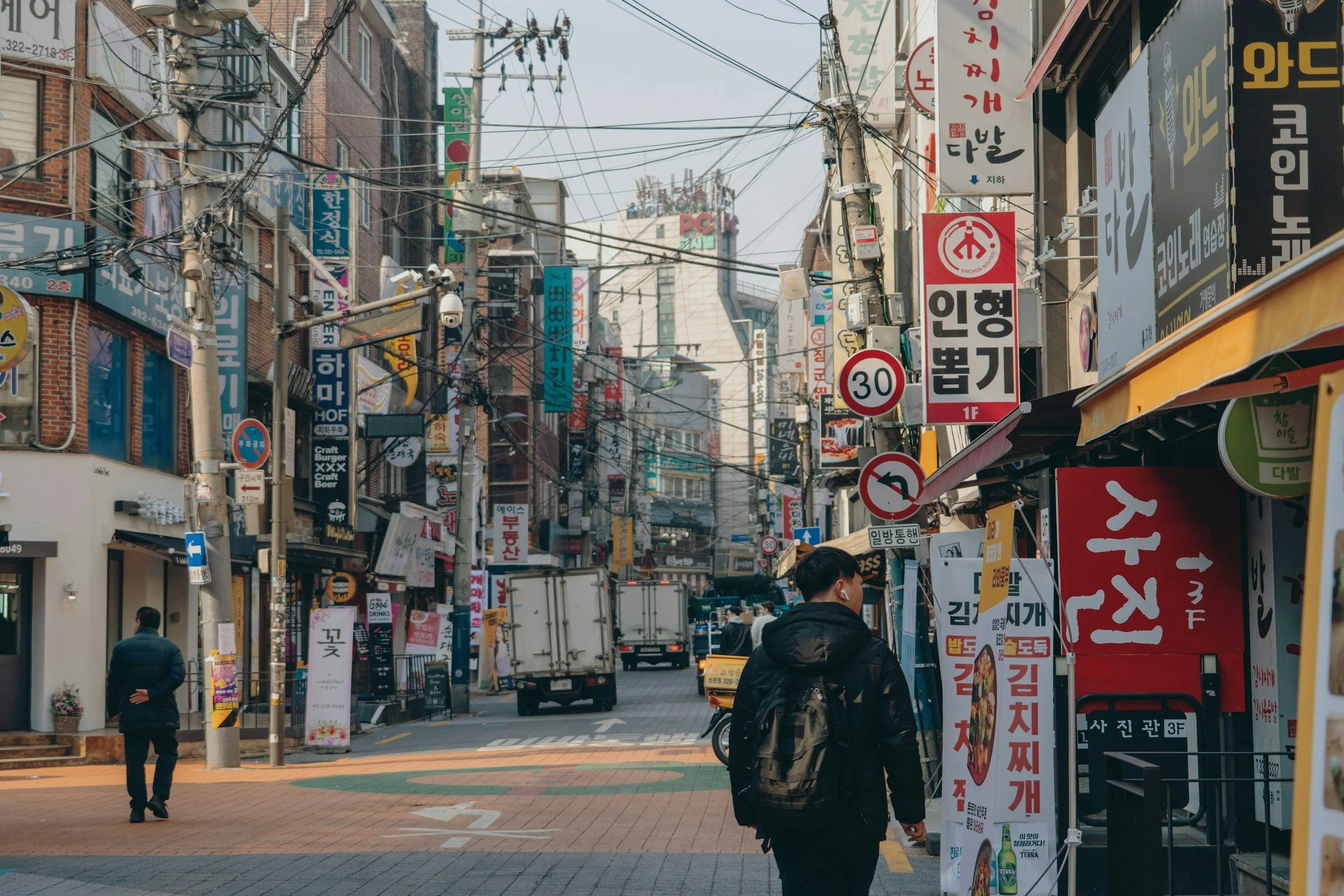 man walking streets seoul