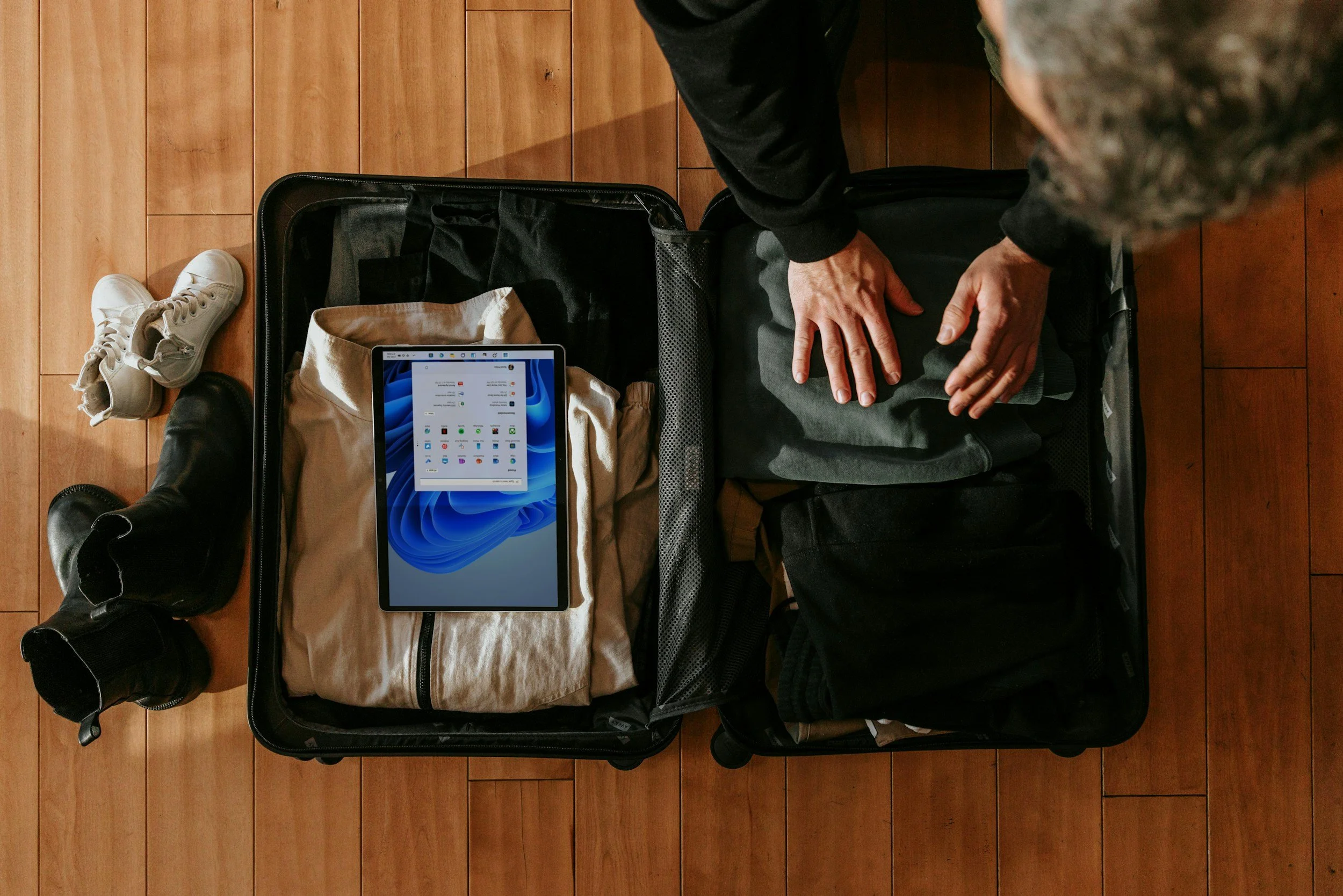 man packing suitcase