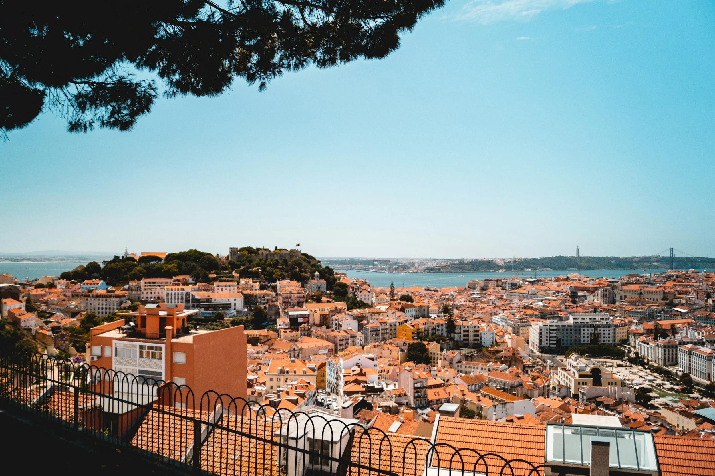 lisbon red rooftops summertime