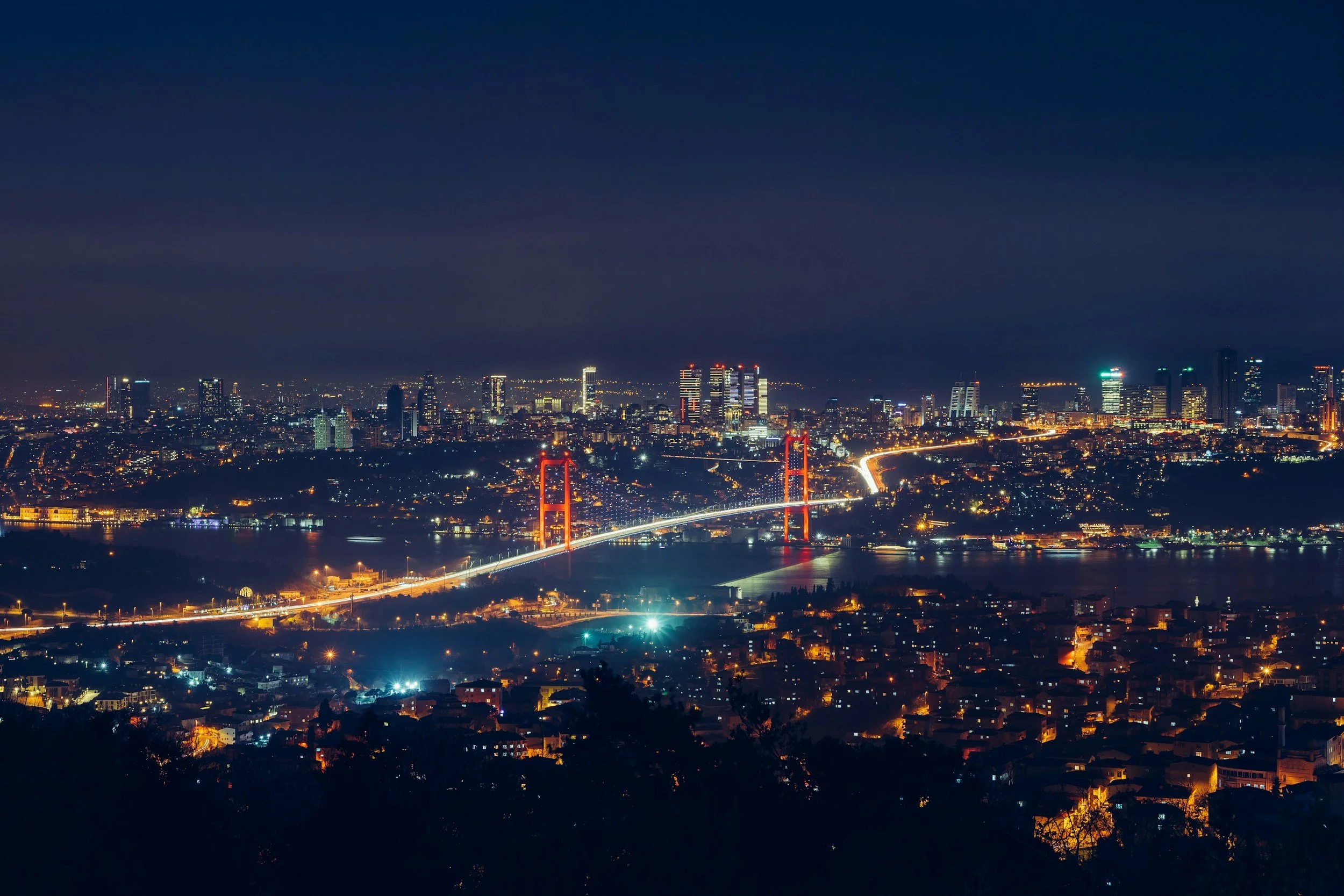 istanbul bridge and city lights at night