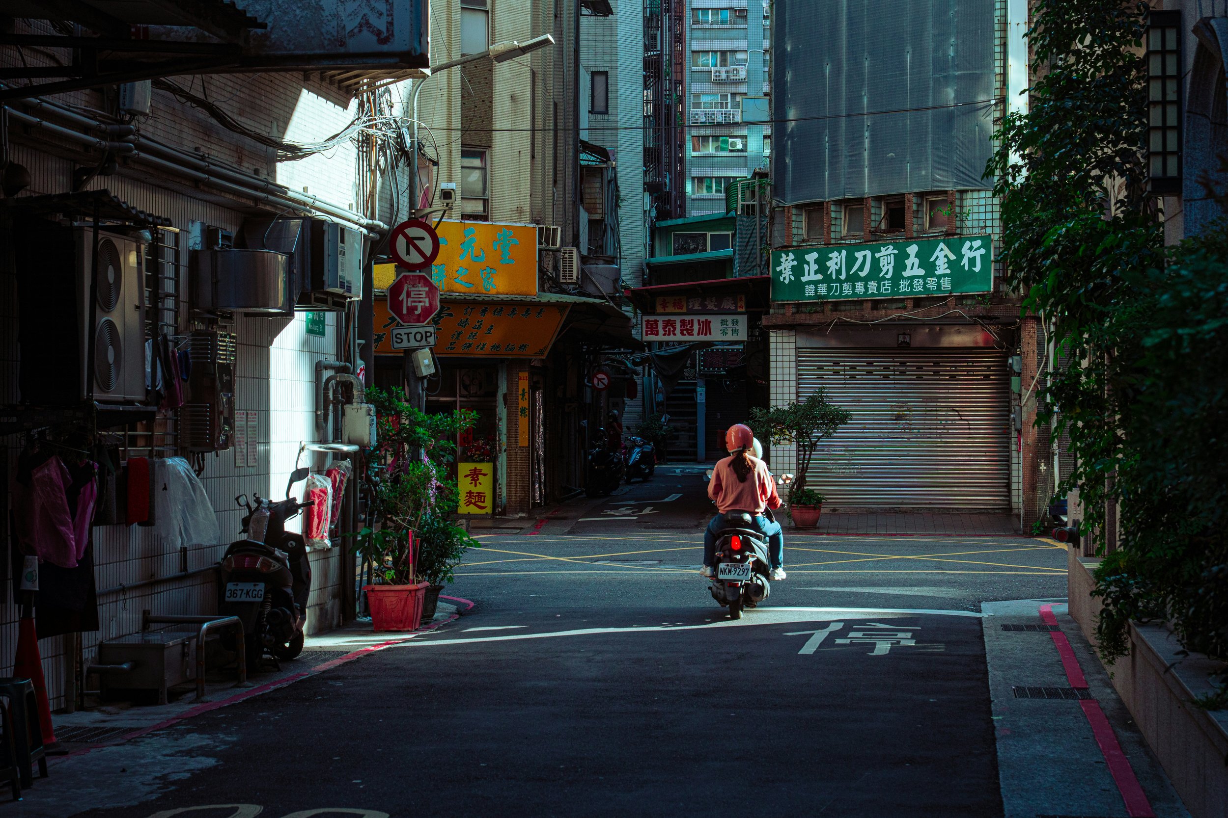 women riding electric scooter asia