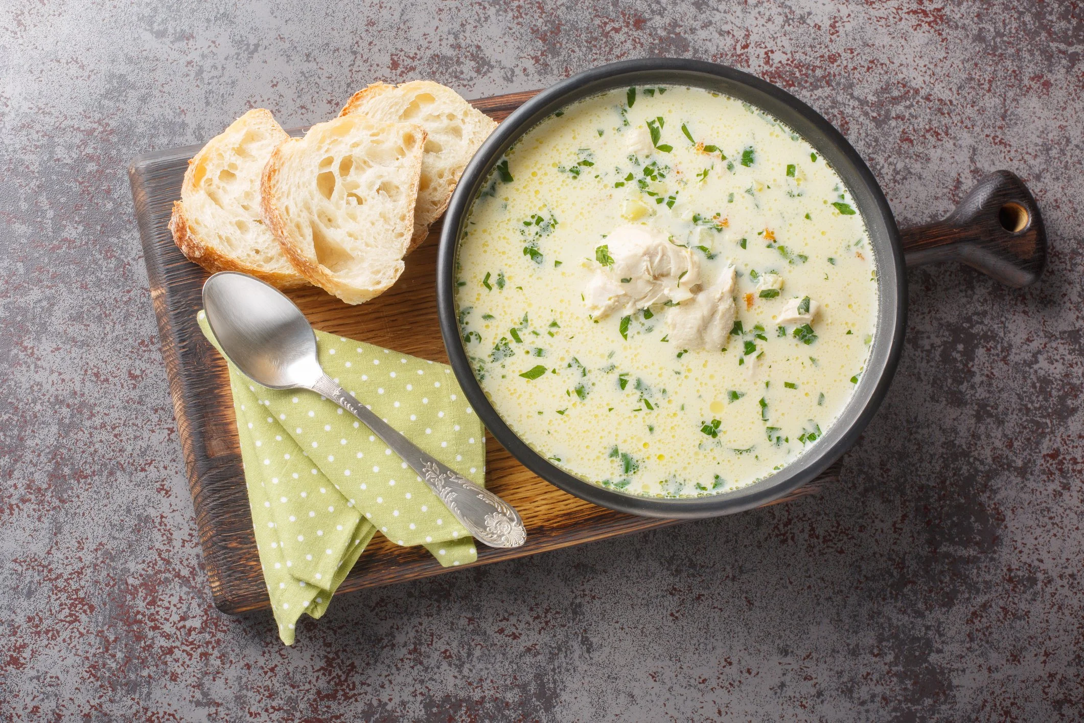 Soup with a bun on a plate