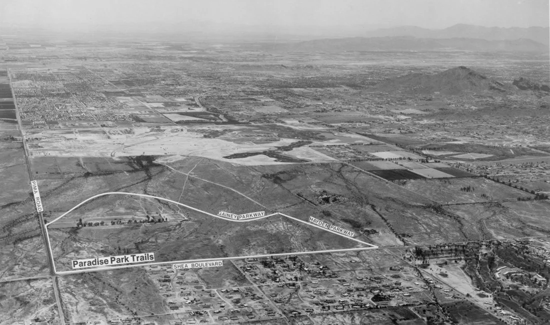 Aerial view of a landscape showing roads, trails, and fields with labels for Paradise Park Trails, Shea Boulevard, Gainey Parkway, Hayden Parkway, and Pima Road