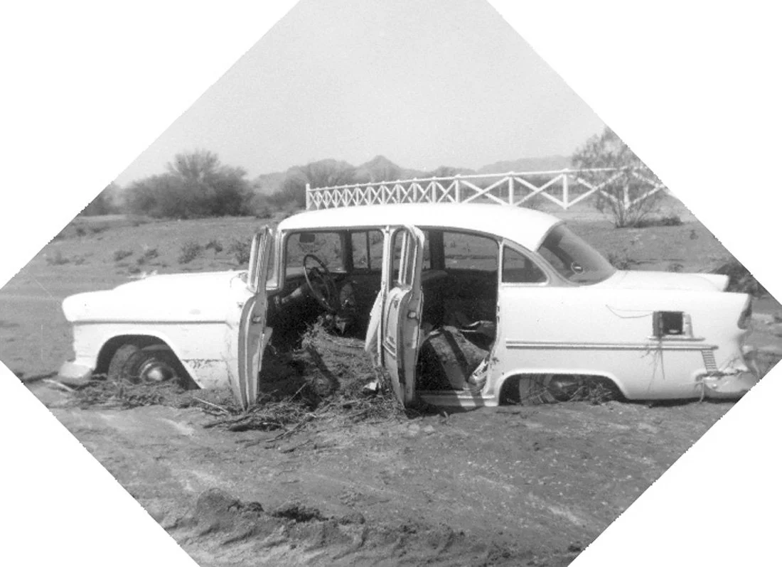 A flooded car with dirt inside of it
