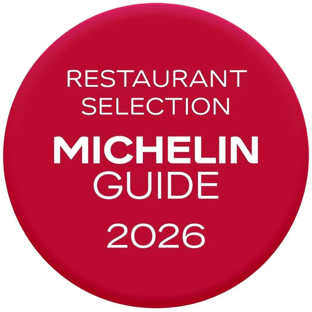 Red circular badge with white text reading 'Restaurant Selection Michelin Guide 2026'.