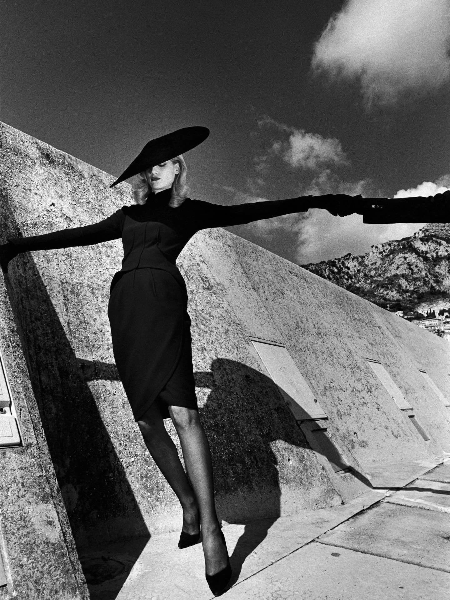 Thierry Mugler, Monaco by Helmut Newton | A quintessential Newton image, where a model clad in Mugler&rsquo;s sculptural design becomes both icon and narrative. Shot in Monaco, the photograph crystallizes the era&rsquo;s unmistakable blend of glamour