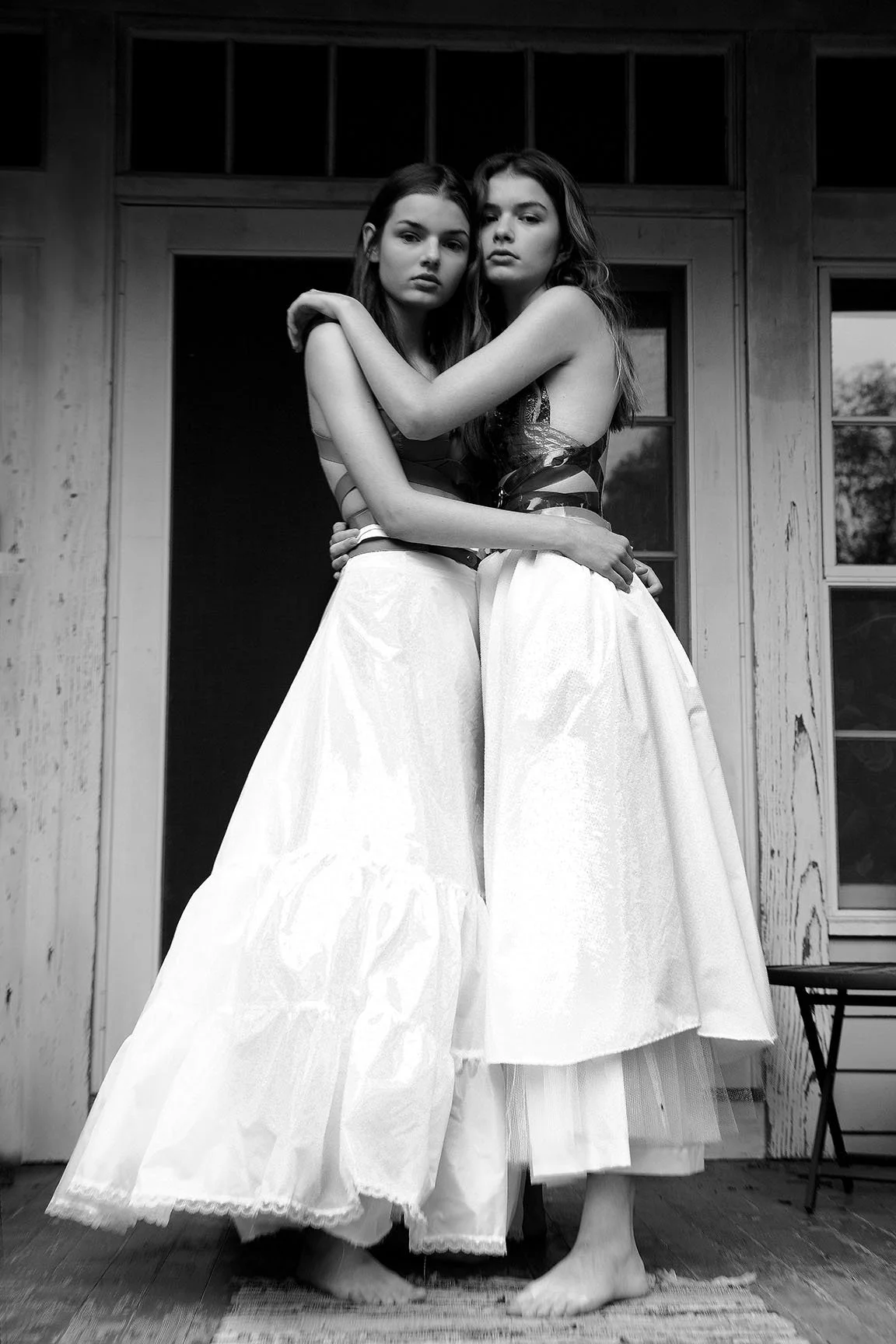 Barefoot by Donna DeMari fine art black and white photograph of two models in dresses, available for purchase at 1905 Contemporary