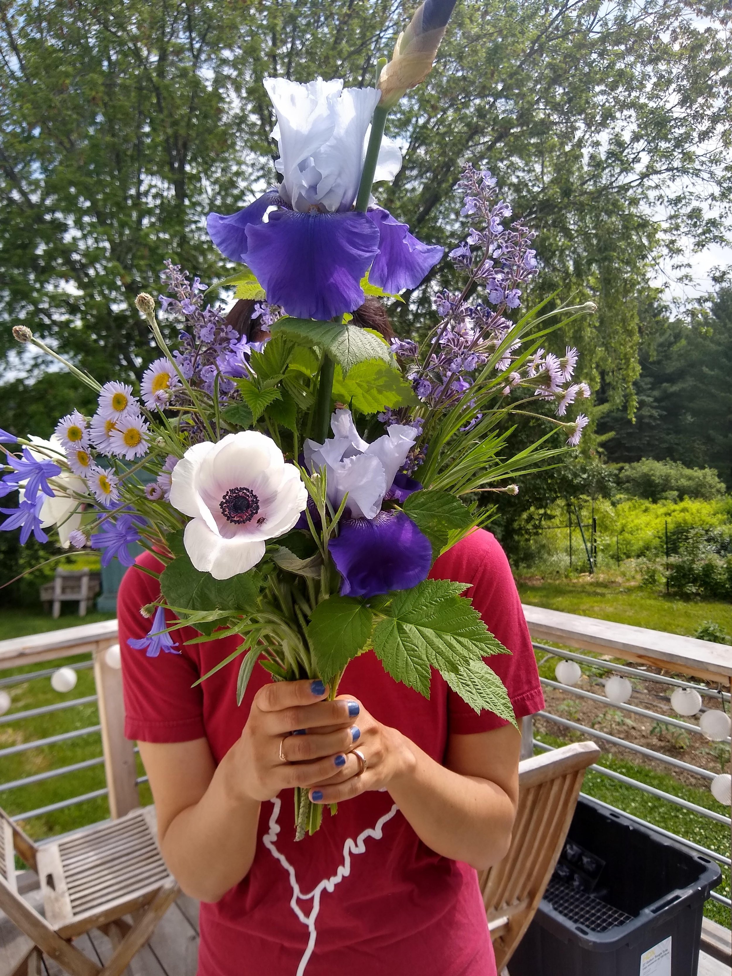 Dr. Lauren Manning holds a bouquet of flowers from her garden