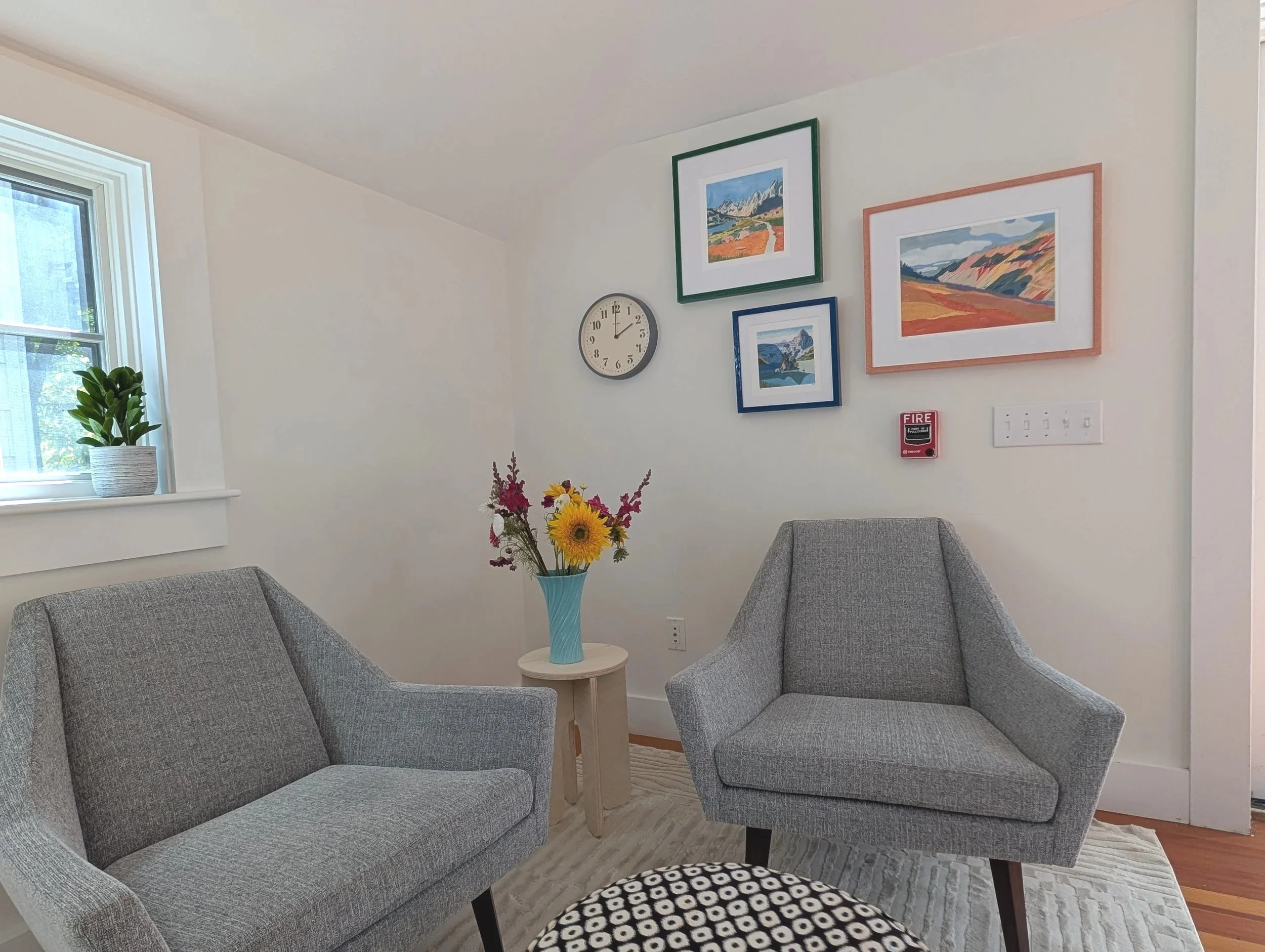 Two chairs in bright office space