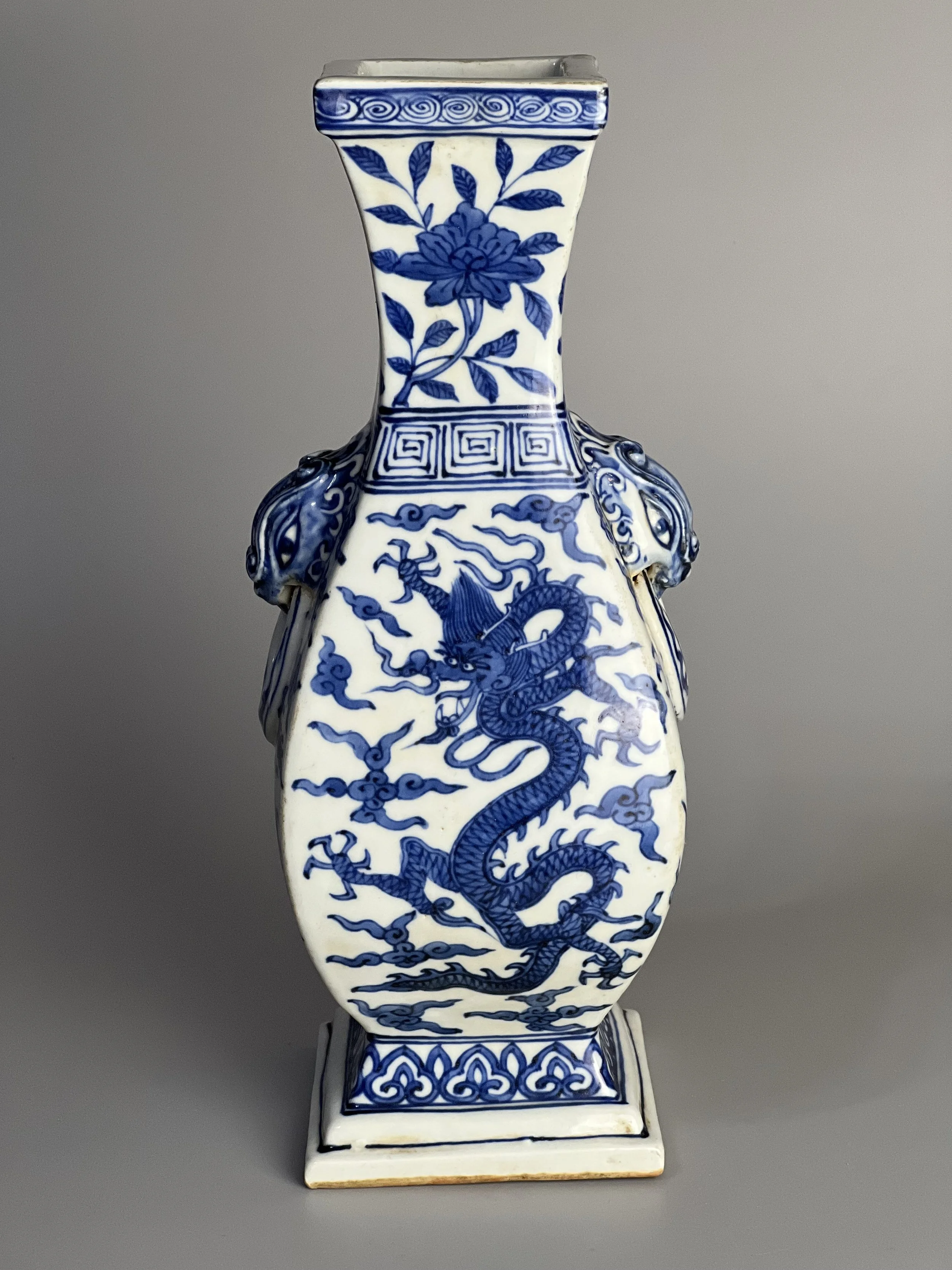 An Introduction to a Ming Dynasty Wanli Period Blue-and-White Square Vase with Dragon, Phoenix, and Animal-Mask Handles