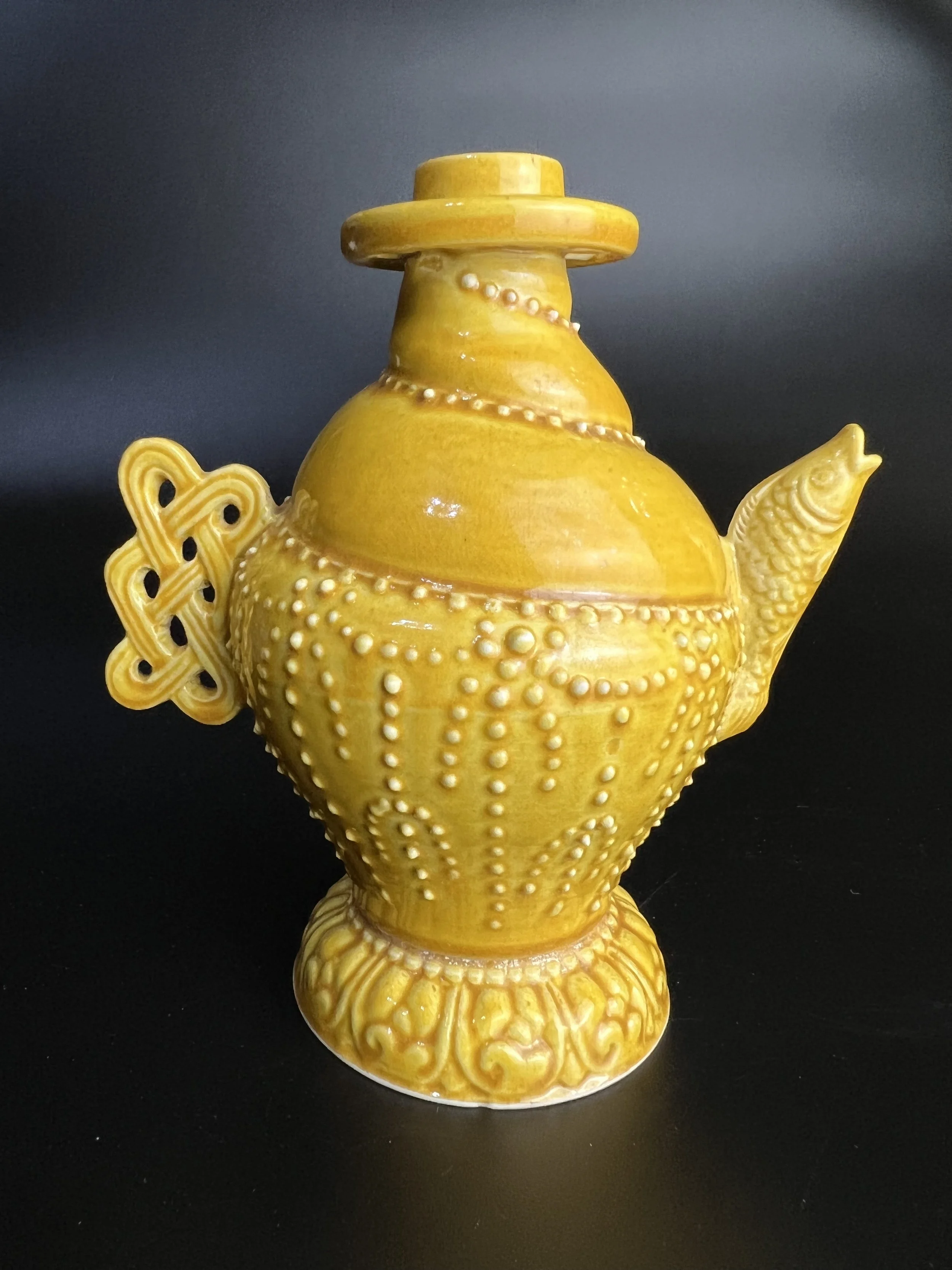 An Appreciation of the Ming Yongle Jiaohuang (Poured Yellow) Glaze Conch-Shaped Ewer with Fish-Mouth Spout