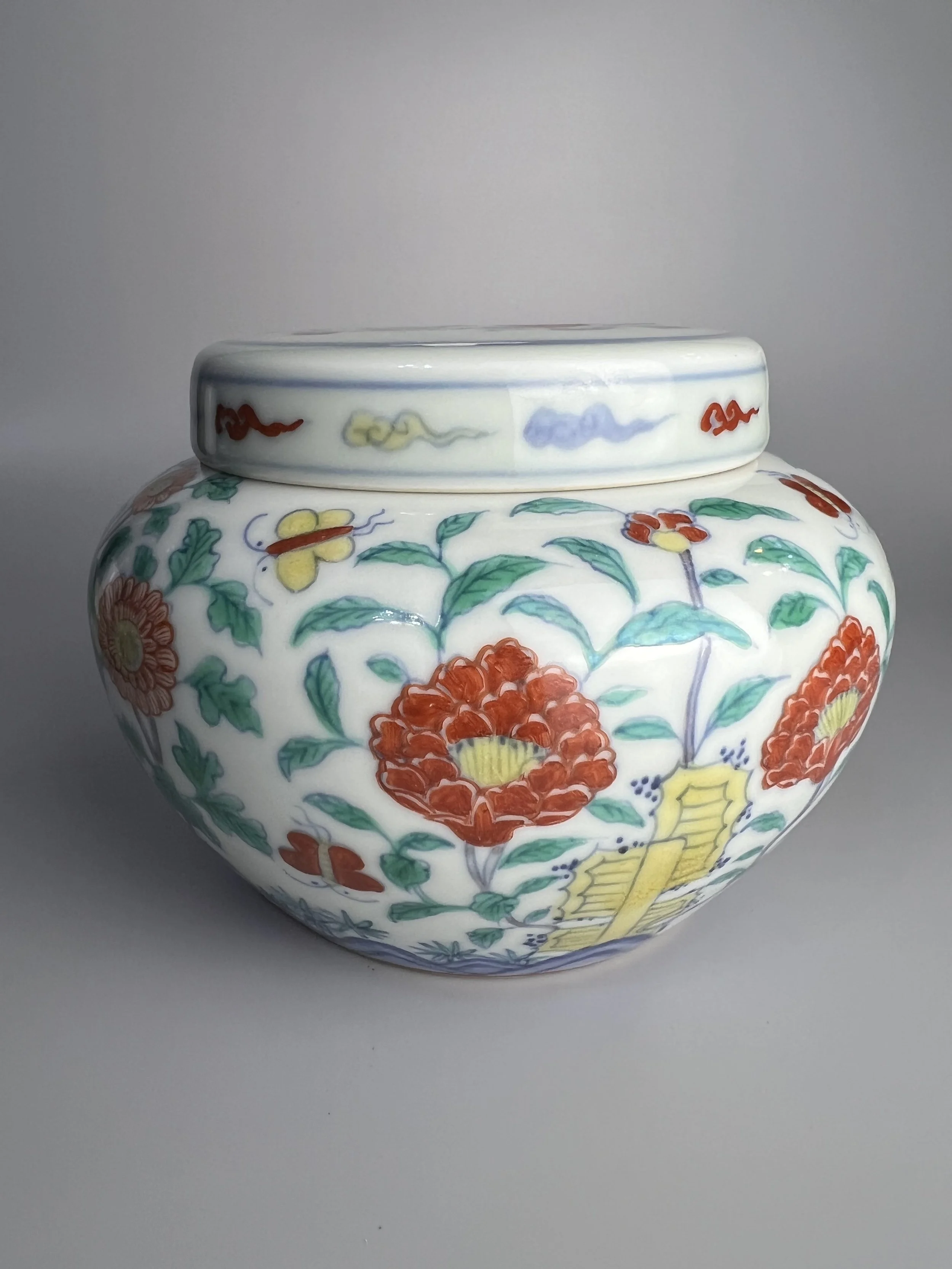 An Appreciation of the Yongzheng-era Doucai Jar with Butterfly, Flower, and Rock Design, in Imitation of Chenghua