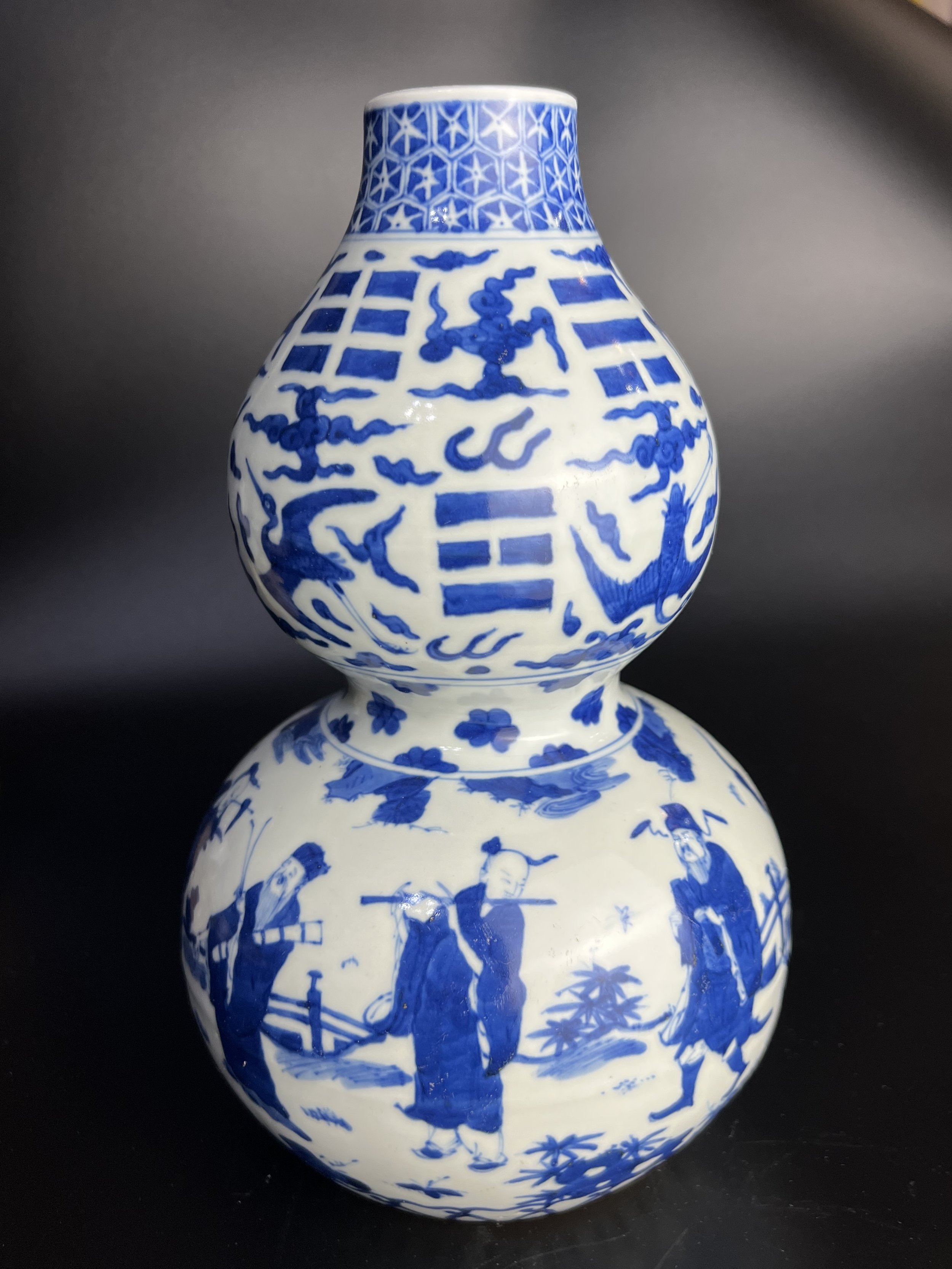 A Blue-and-White Double-Gourd Vase with the ‘Eight Immortals’ and the ‘Eight Trigrams’, Longqing Mark and Period