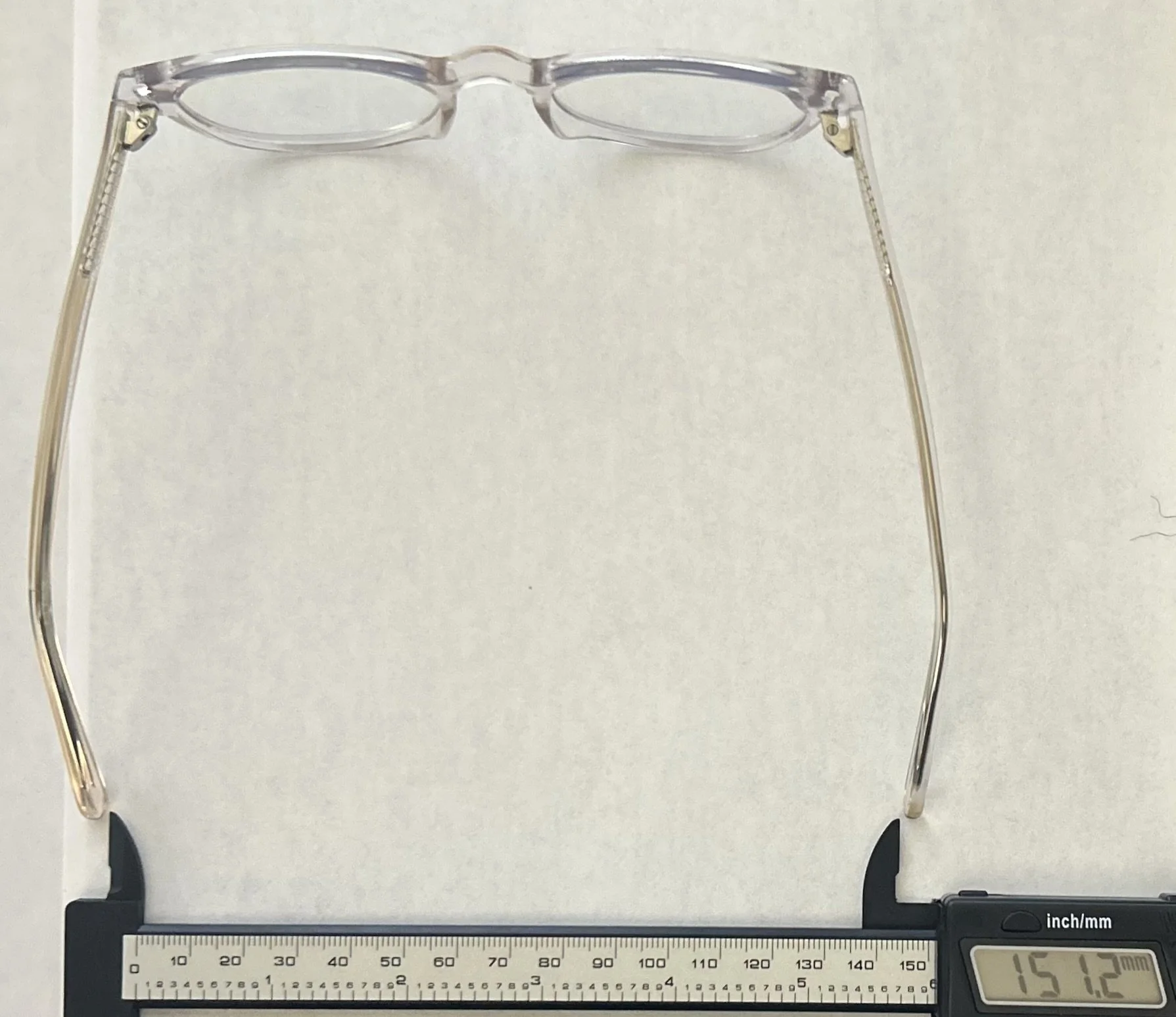 Digital caliper measuring a pair of glasses at 151.2 millimeters wide without TempleFix applied.