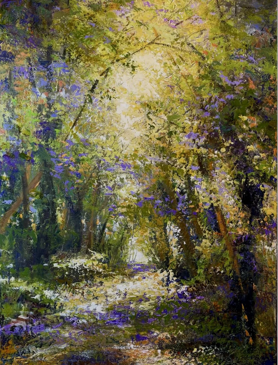 A vibrant painting of a forest scene with a sunlit pathway surrounded by trees with green and purple leaves, creating a colorful canopy.