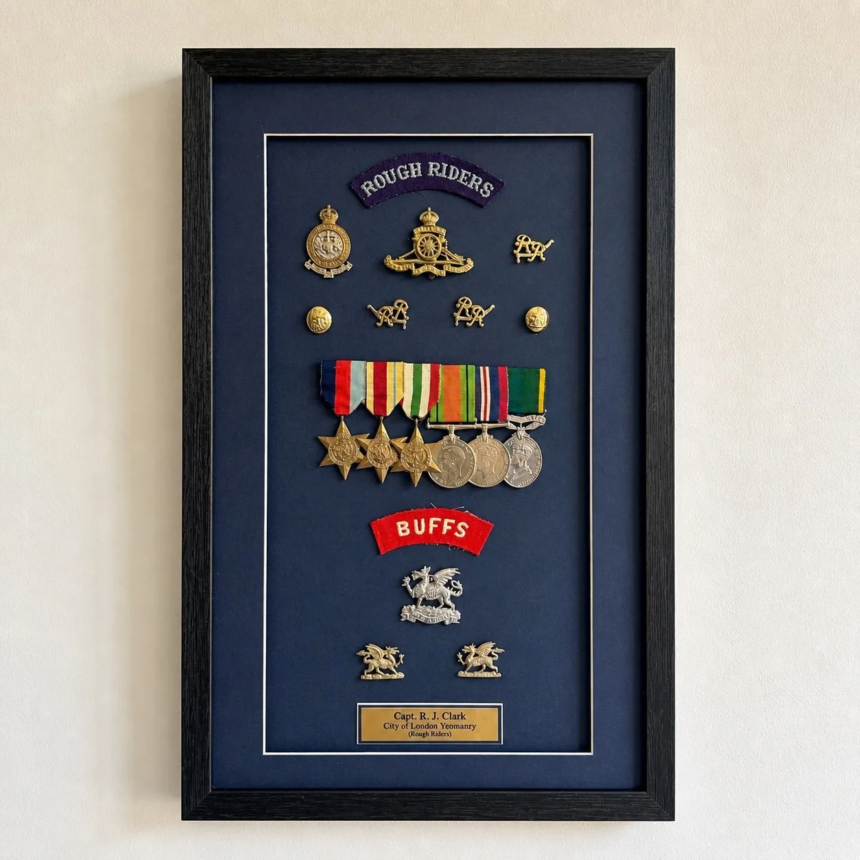 Memorabilia Framing — Custom medal framing with structured layout to protect and present multi-piece collections with clarity.