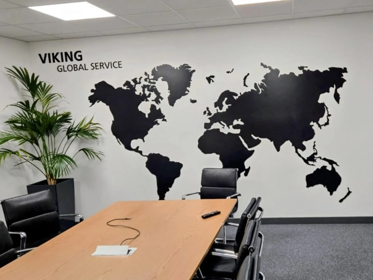 Plain meeting walls deserve something interesting. 

This custom world map was created for Viking Life-Saving Equipment using 5mm black foamex, cut to shape and fixed to the wall using VHB tape. 

Produced from client-supplied artwork, this piece rep