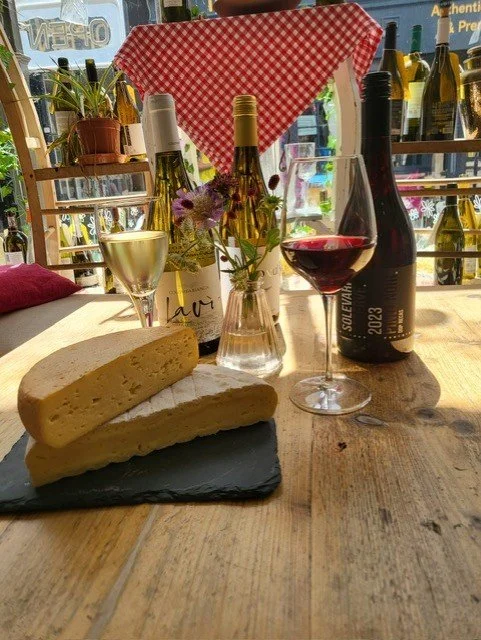 wine bottle and cheese wedge.jpeg