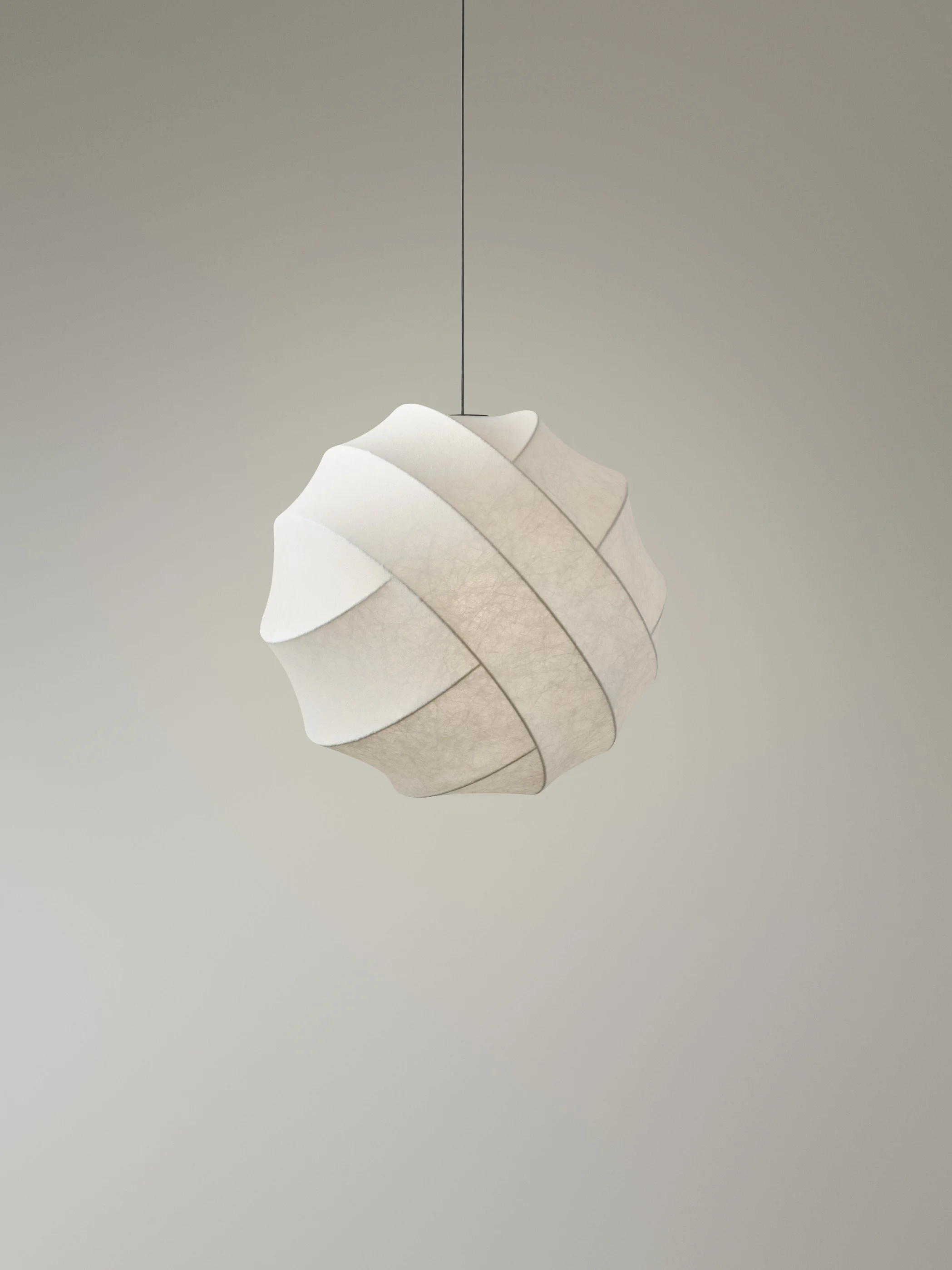 A modern, white pendant lamp with a layered, petal-like design hanging from a ceiling against a plain background.