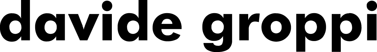 Davide Groppi Italian lighting logo. Minimalist, sculptural luminaires defined by lightness and poetic design
