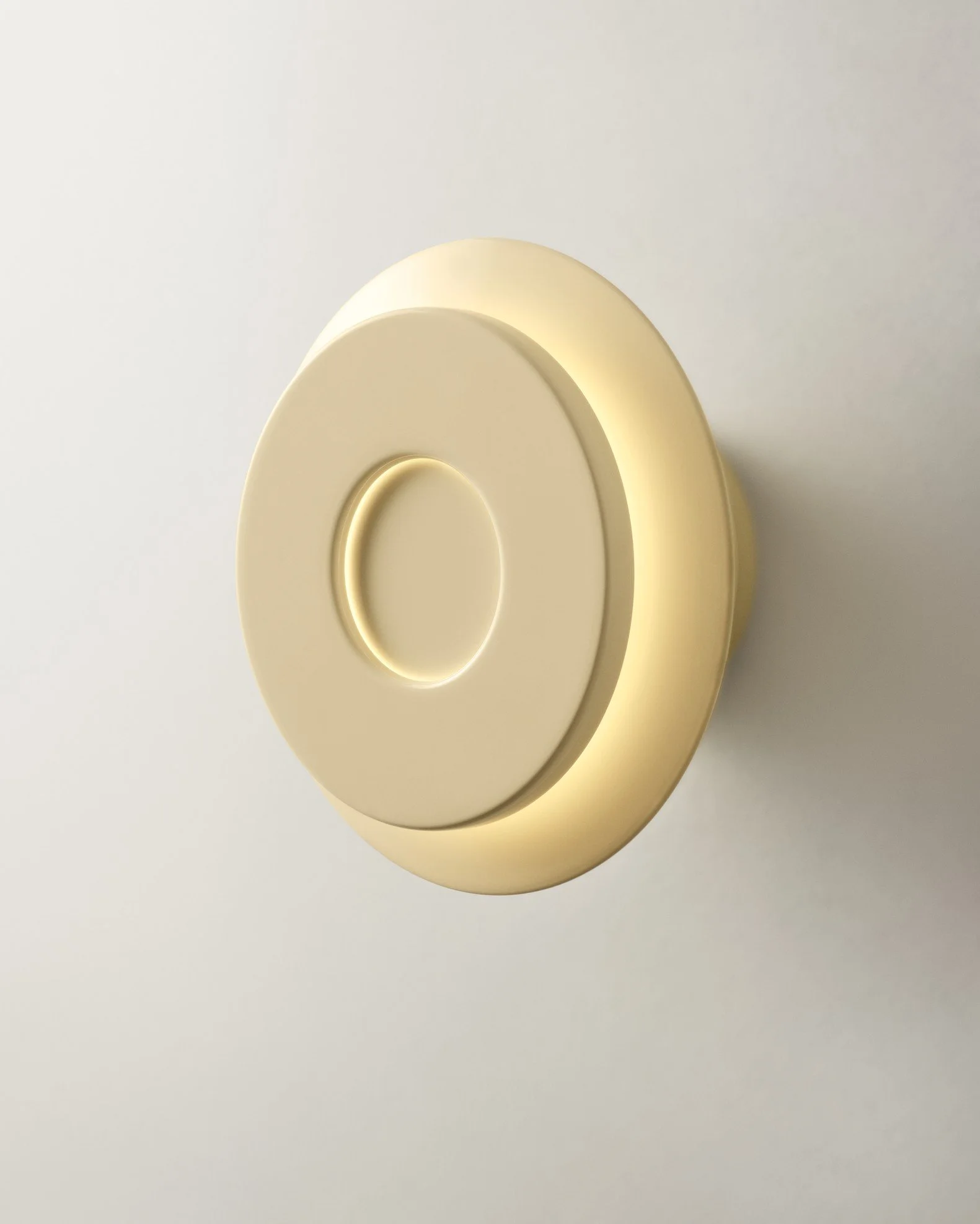 Illuminated circular light fixture mounted on a wall