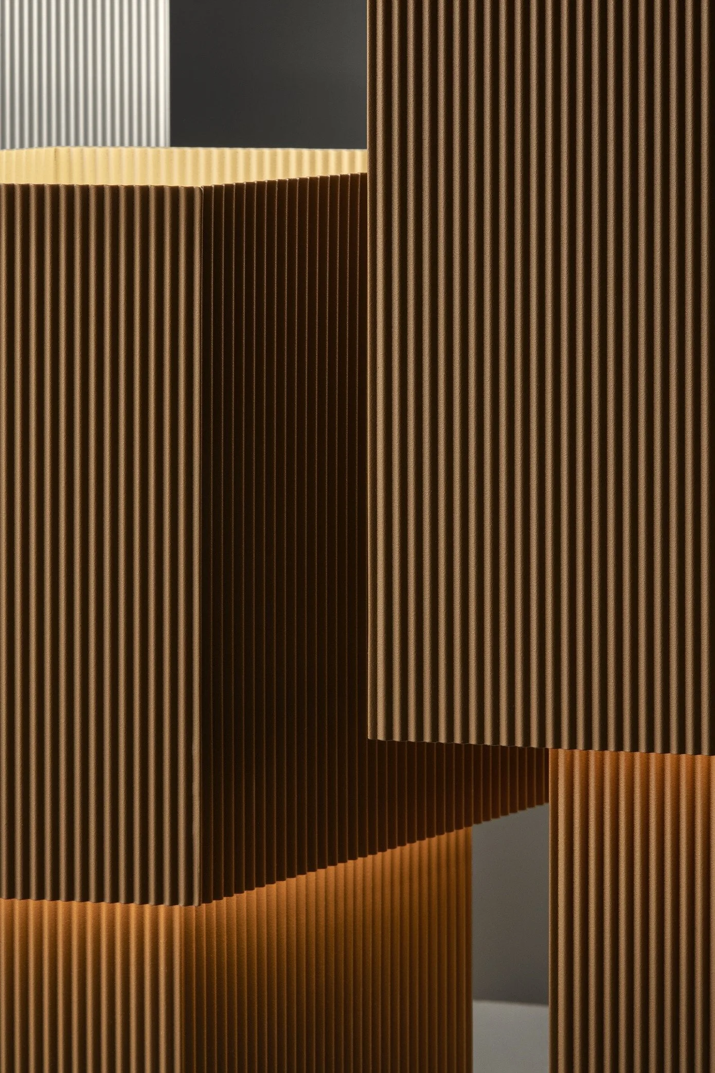 Close-up of vertically grooved wooden panels arranged in geometric design.