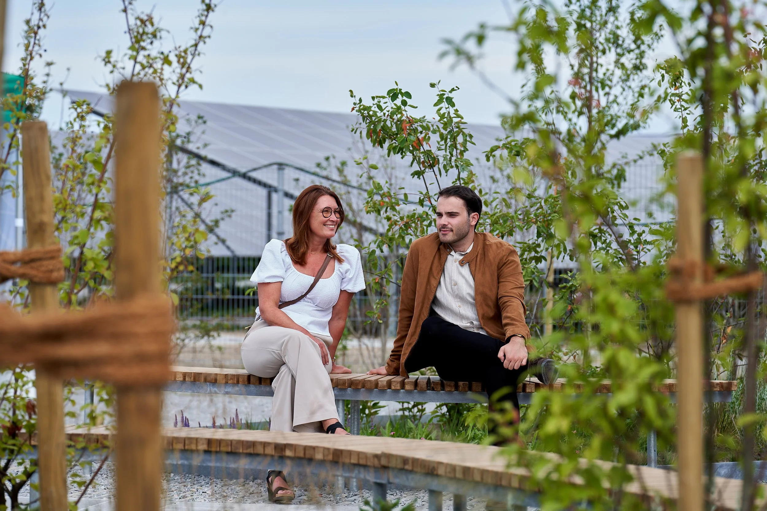Two persons sitting on a bench
