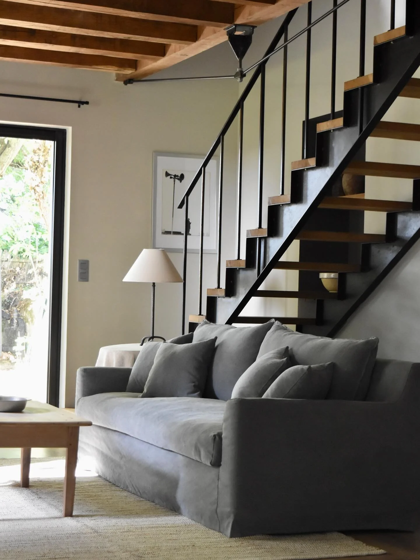 Sitting room in the g&icirc;te. There are doors straight onto the park and a wood burner for the cooler evenings #chateaudechavigny
