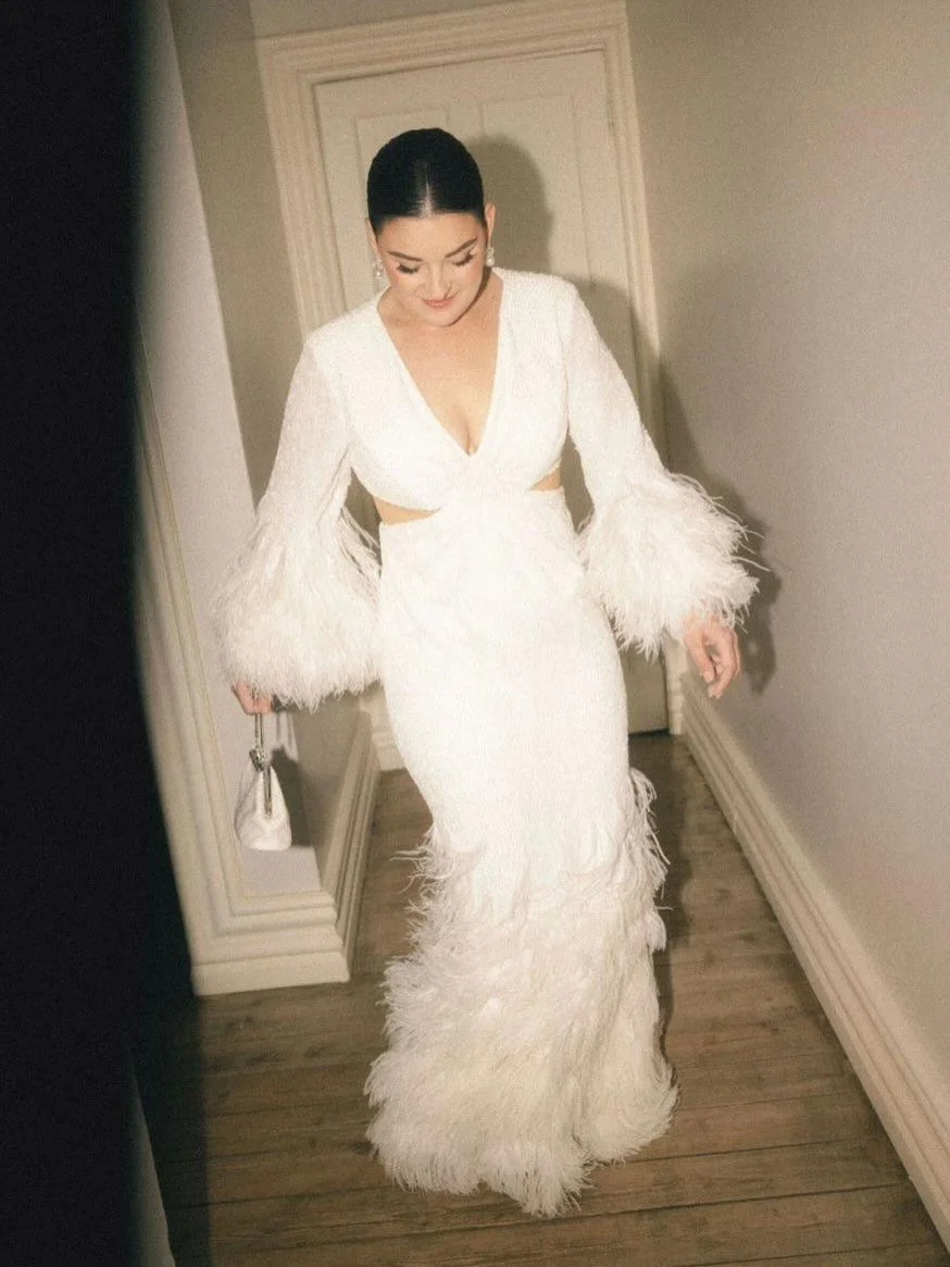 T A Y L A  PART 2 

Now we can P A R T Y !!! 

Yes, the Feathers make the dress! This Sparkly beaded gown with Ostrich feathers added enough FUN  to this look and movement through out the whole dance floor! 

▶️▶️▶️ SWIPE TO SEE THE BEAUTIFUL BACK! ▶