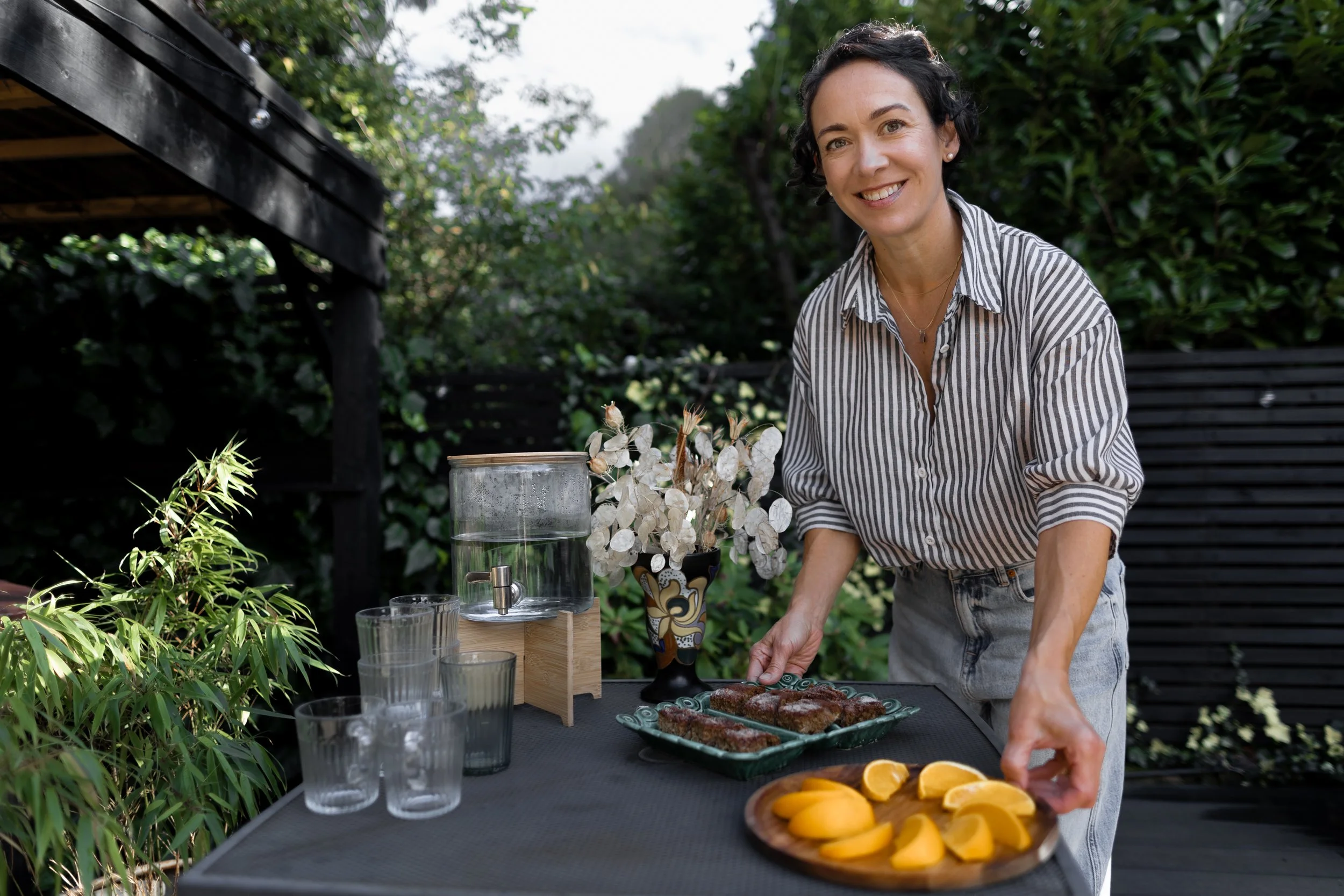 Alice offering orange slices and sweet treats