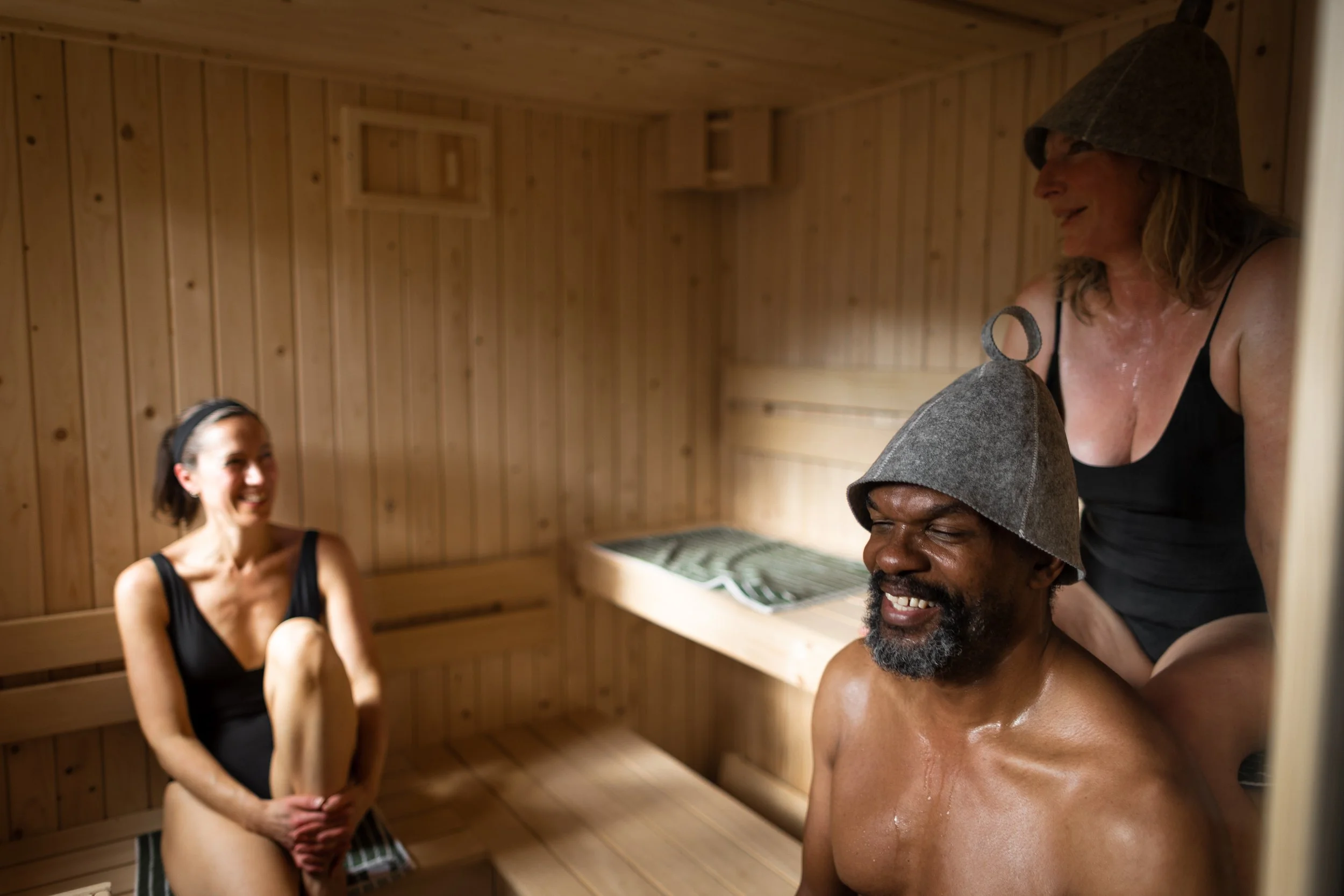 Happy people in the hot sauna