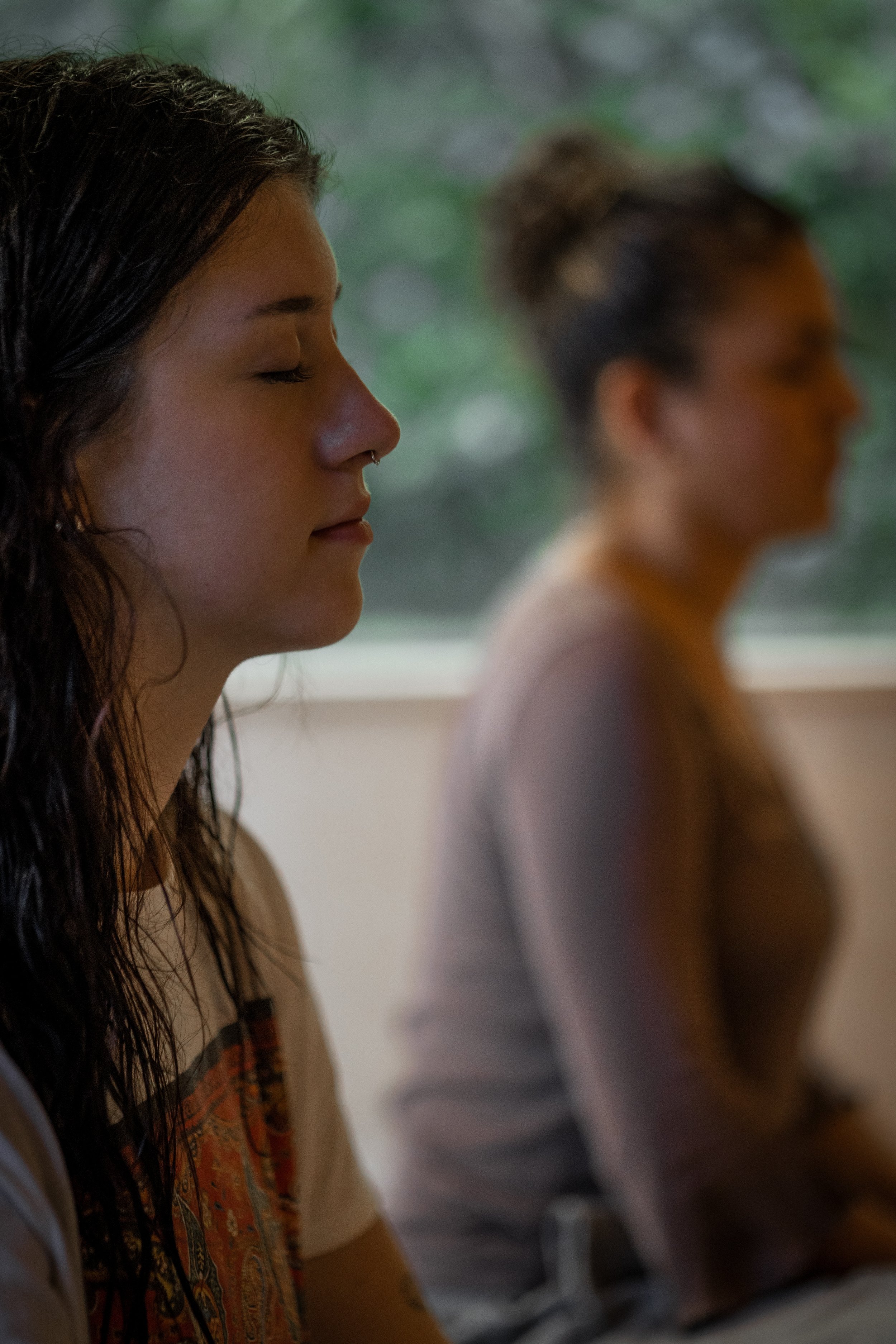 2 girls meditating with eyes closed