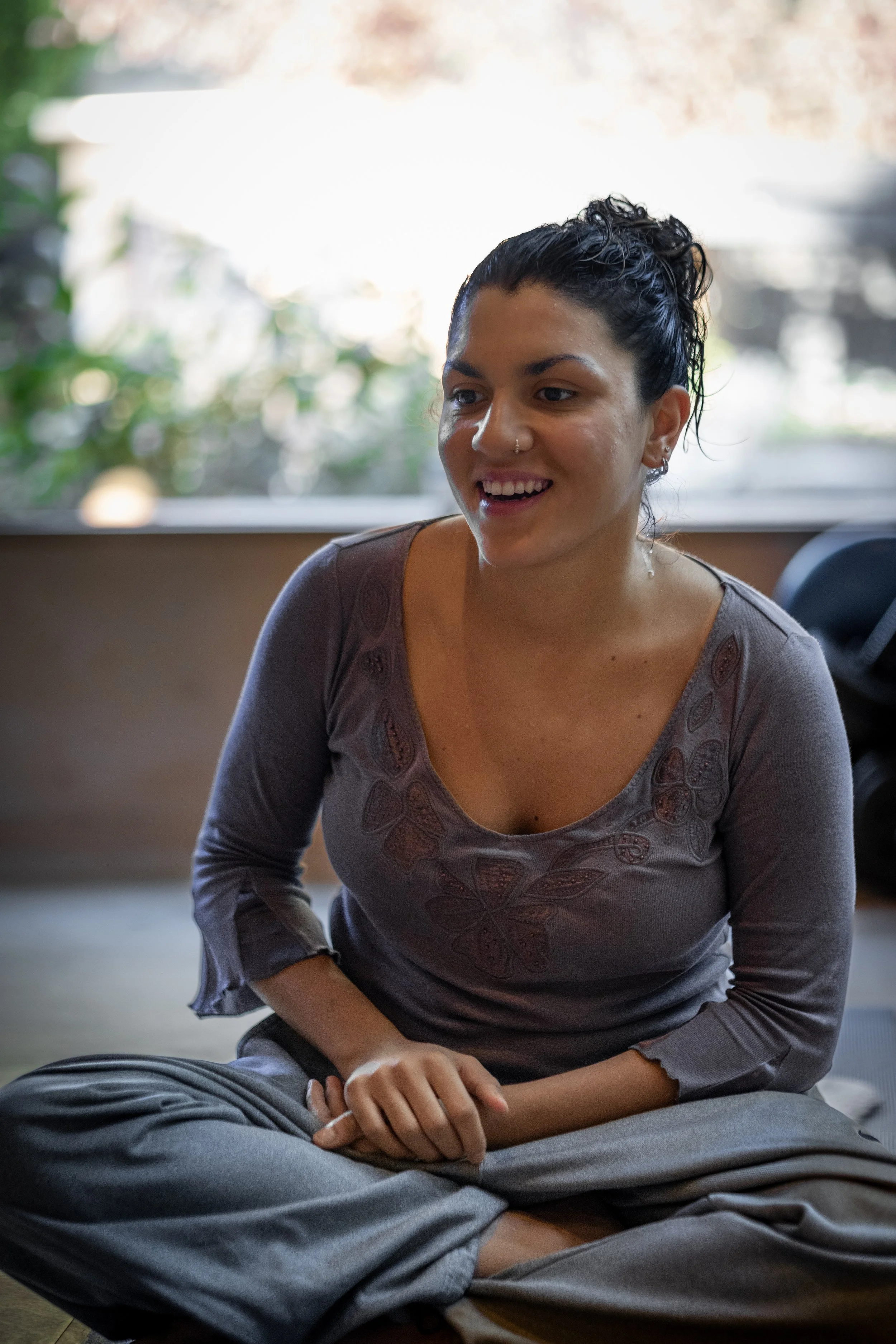 Girl smiling in a meditation session