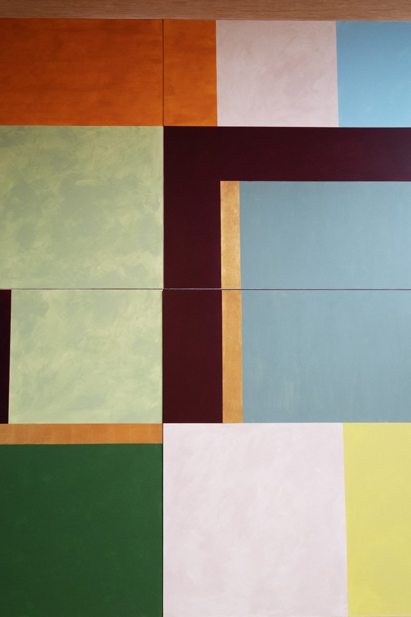 Detail of vibrant color block mural on panel doors