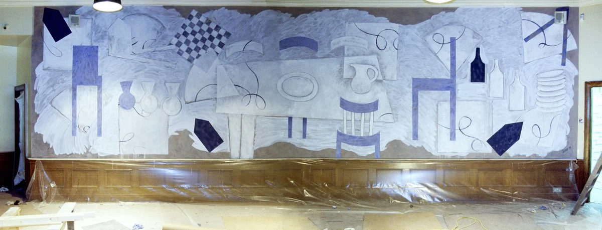 Dining Rhythm, a large-scale Cubist-inspired restaurant mural in cool blues and white, featuring stylised tables, chairs, bottles and vases interwoven with geometric patterns and flowing lines above wooden dado panelling.