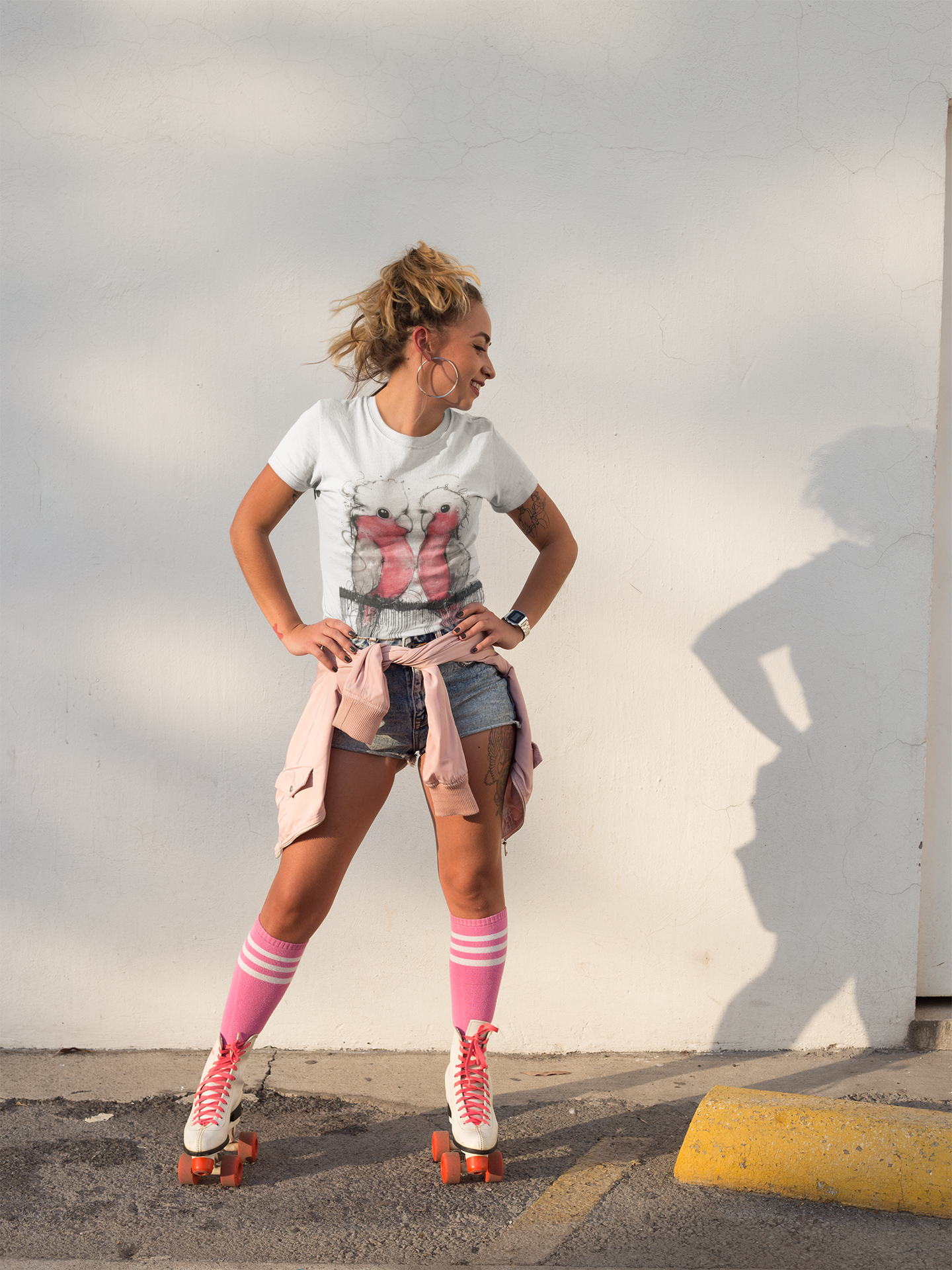 smiling-girl-wearing-a-t-shirt-mockup-while-using-roller-skates-a18540.png