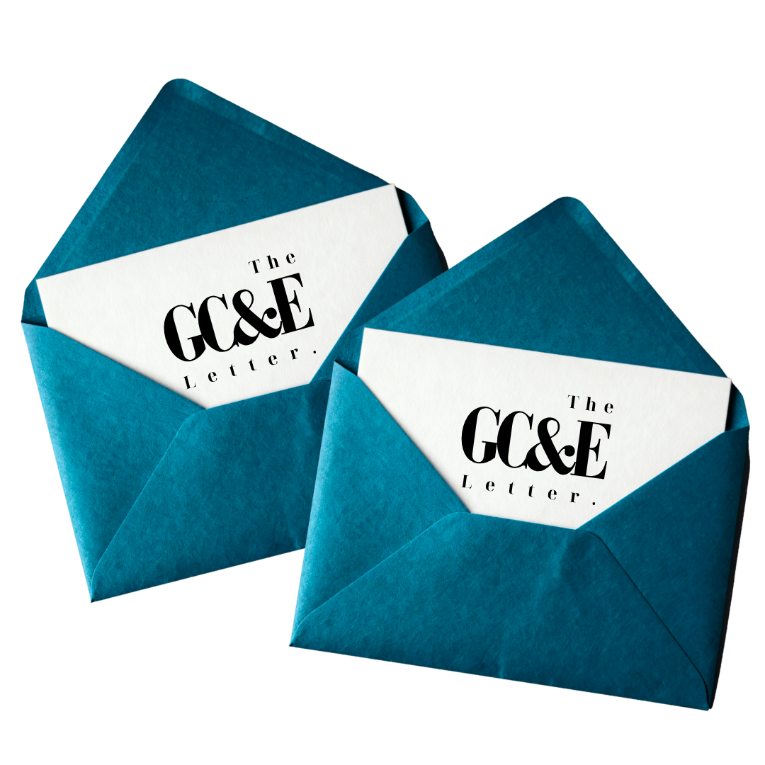 Two blue envelopes containing white cards with black text that read 'The GCE Letter'.