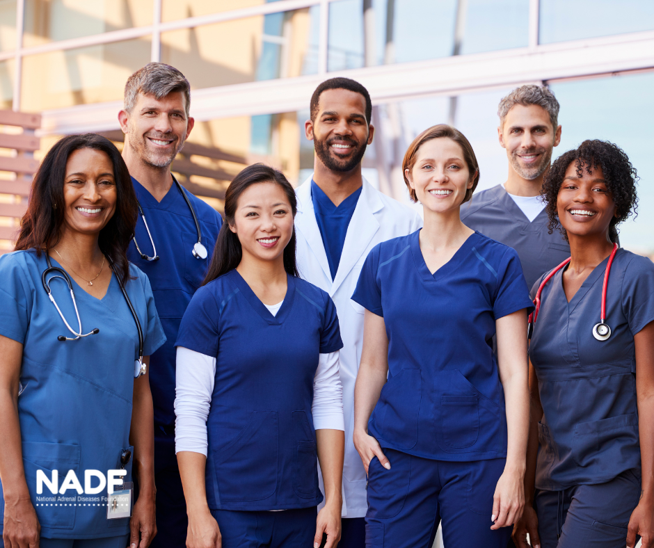 A group of healthcare providers smiling at the camera.