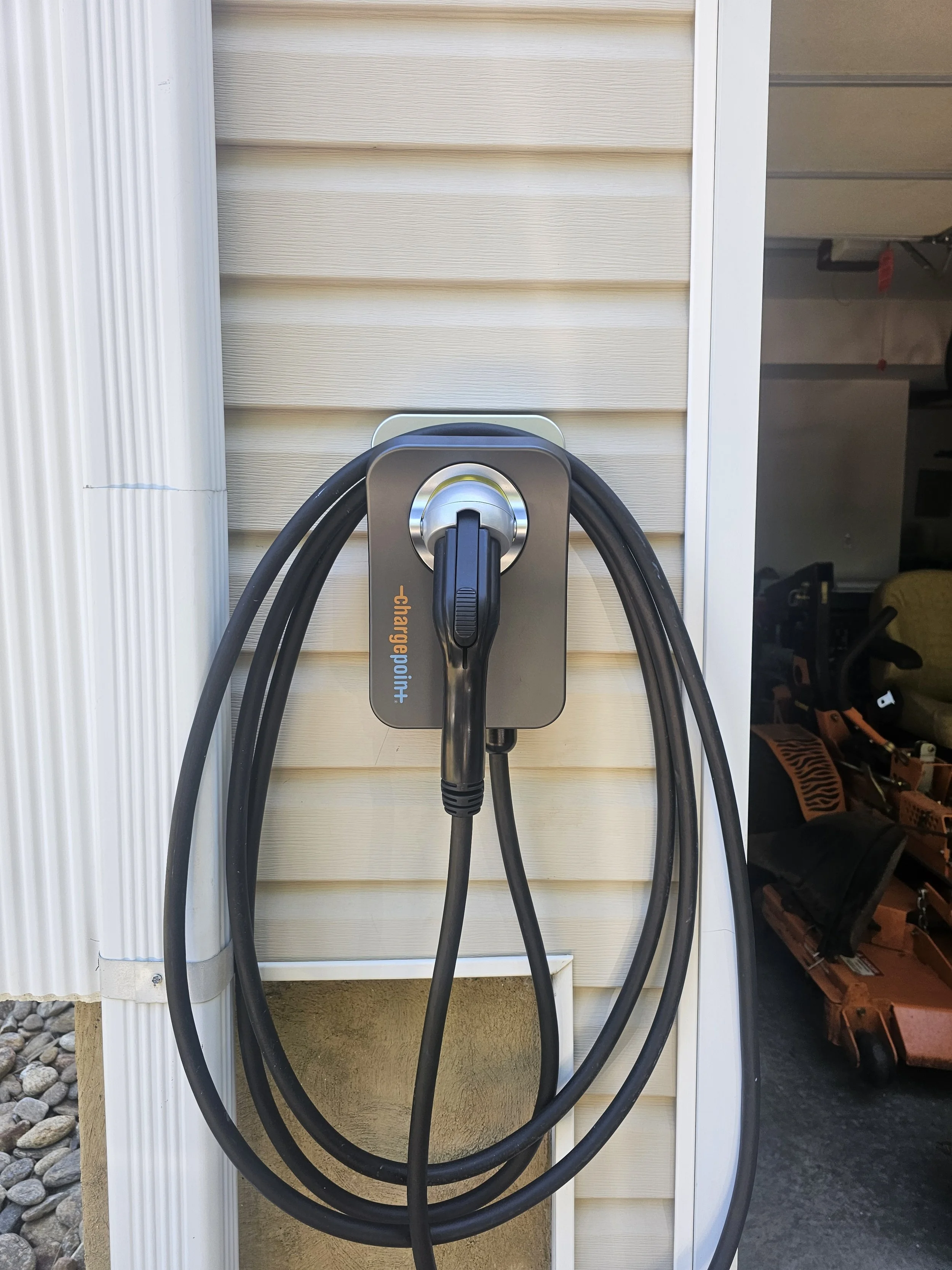 Exterior ChargePoint home charging installation.
