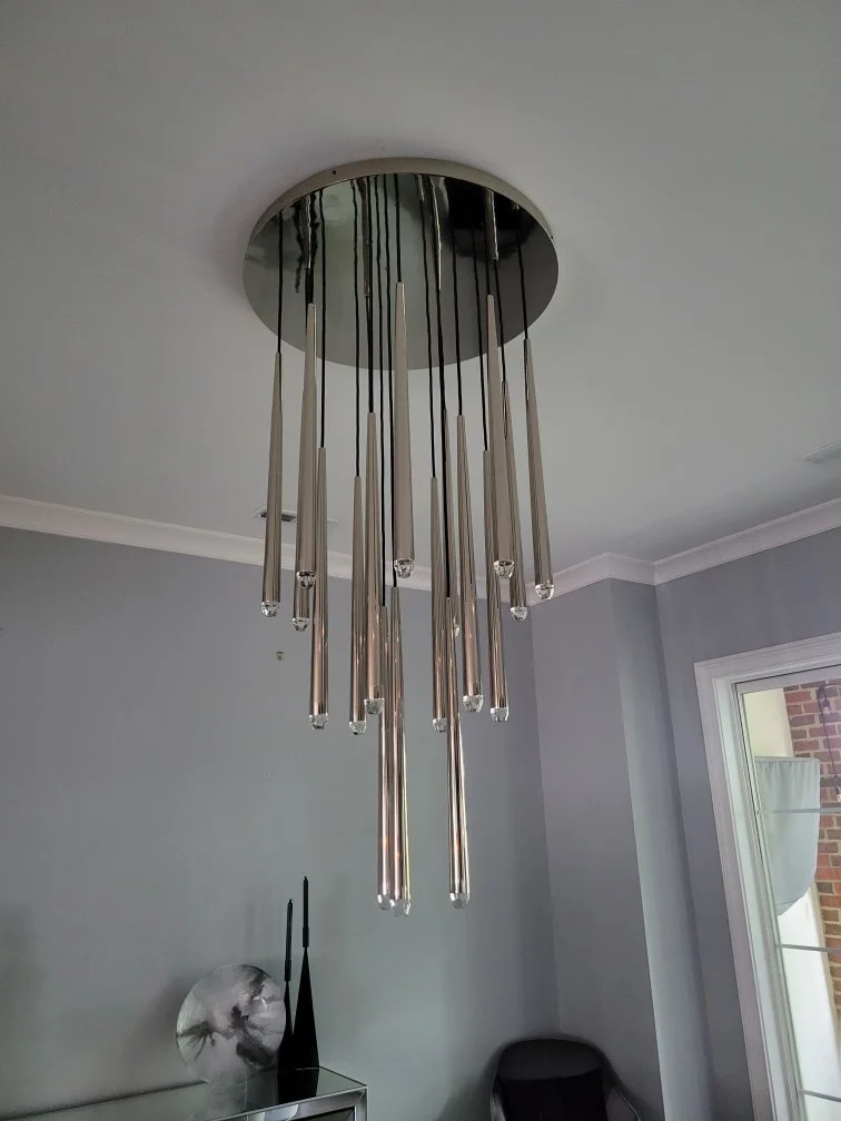 Chrome multi-pendant chandelier installed by Loftis Lighting & Electrical. Explore our chandelier and lighting installation services.