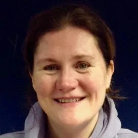 Smiling woman with dark background