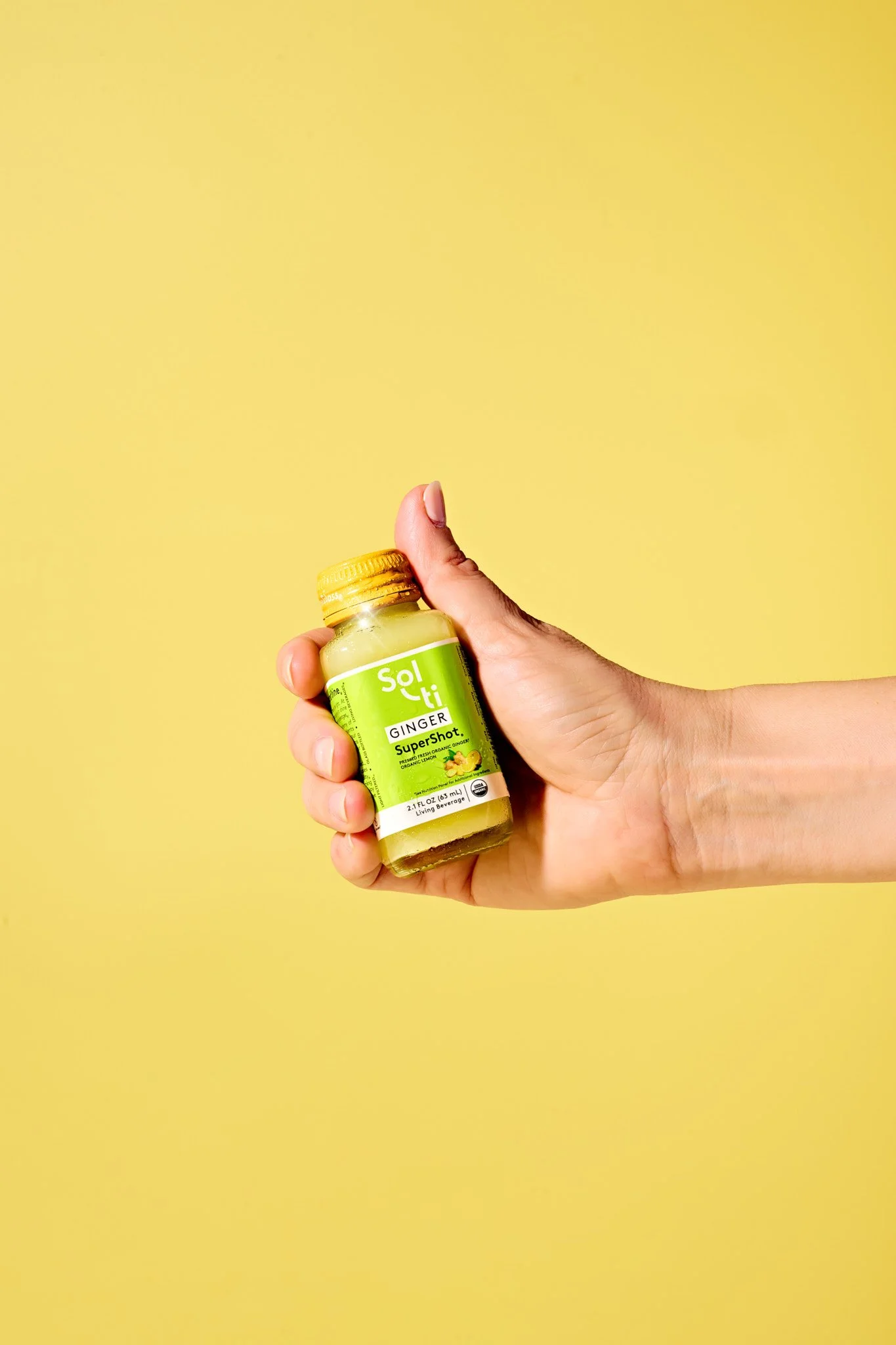 brand commerical photography photographer ginger lemon supershot beverage food branding hand holding product