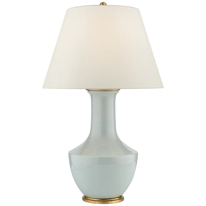 White ceramic table lamp with a beige fabric lampshade.