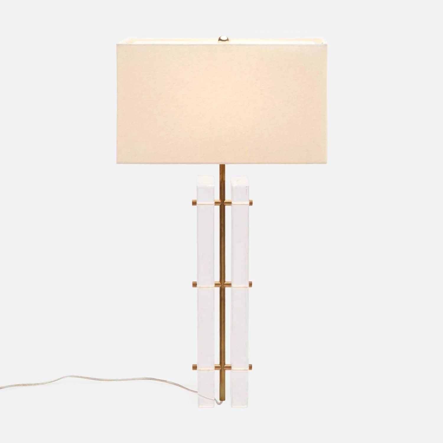 A modern floor lamp with a rectangular beige lampshade, a gold-colored central pole, and vertical white transparent rectangular accents on either side, set against a plain light background.