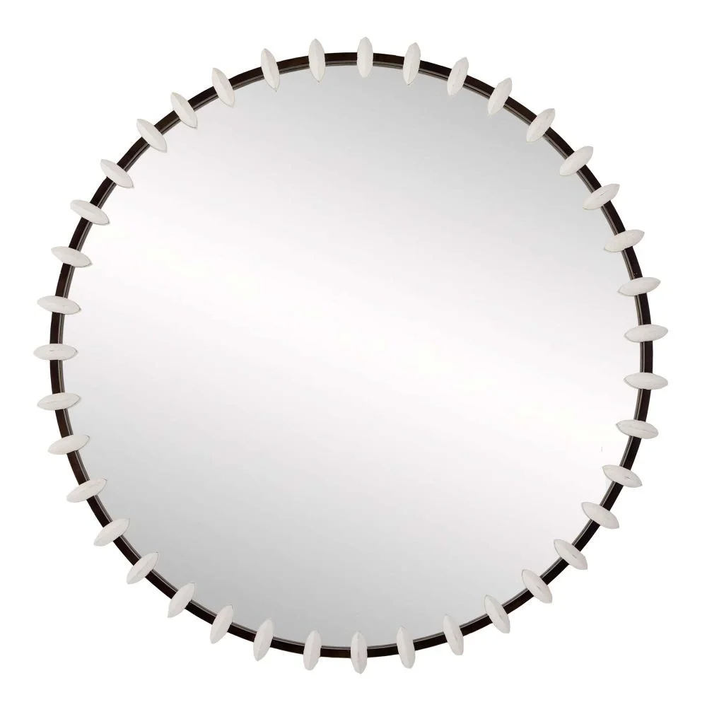 Round wall mirror with a decorative frame of white oval-shaped elements around the edge.
