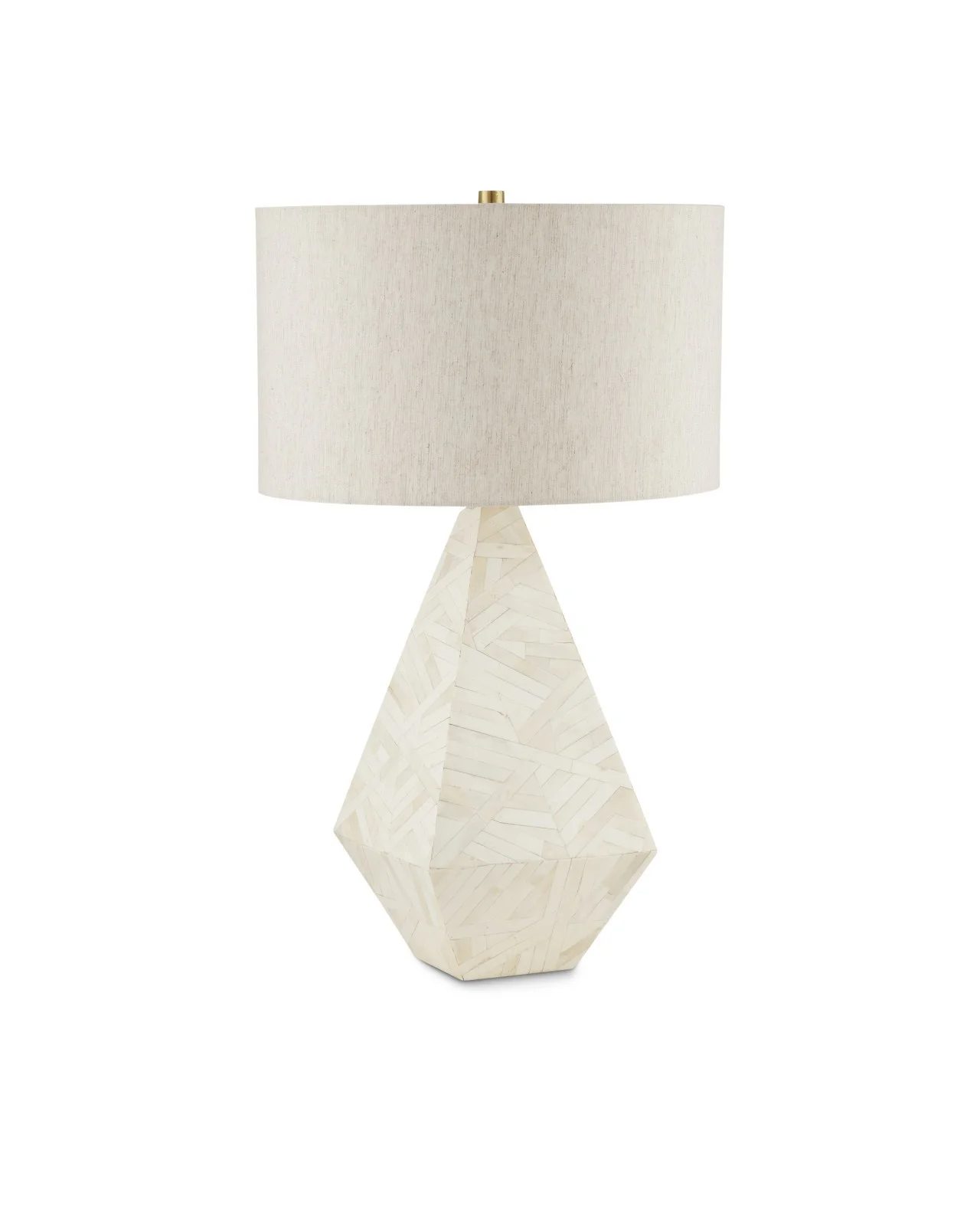 A decorative table lamp with a faceted, geometric base and a large, cylindrical fabric lampshade.