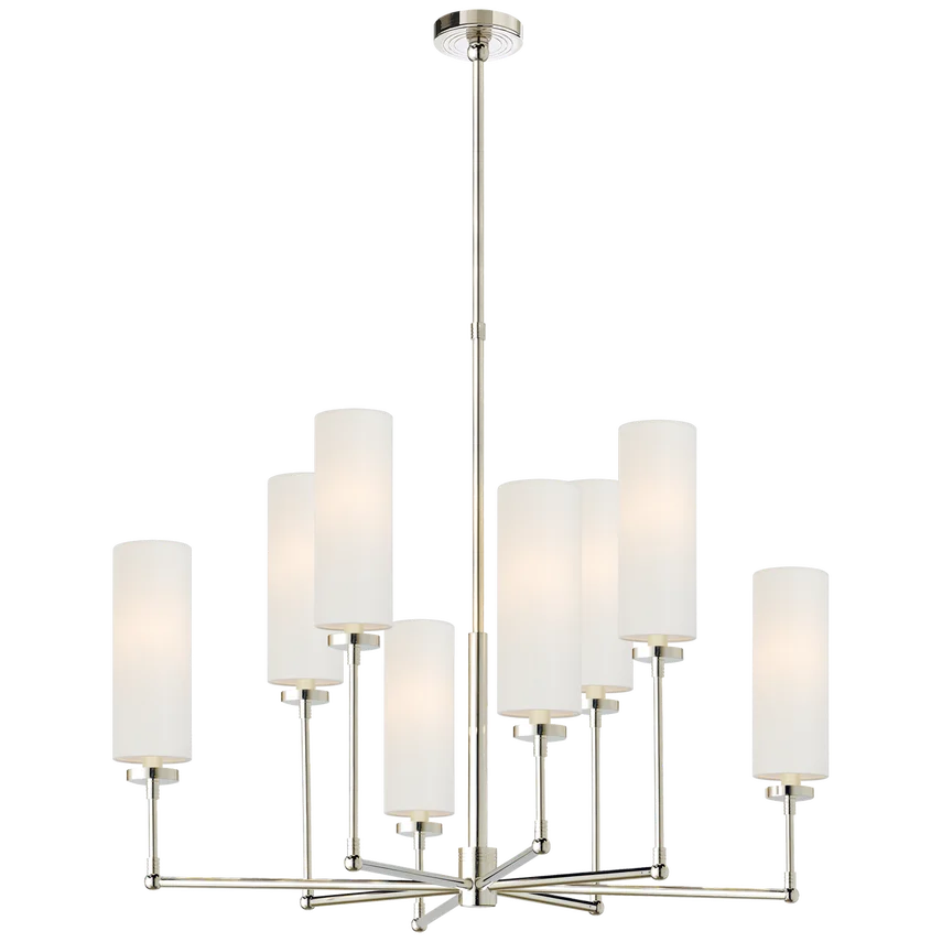 A modern chandelier with multiple cylindrical white lampshades arranged in a tiered design, hanging from a metallic central stem.