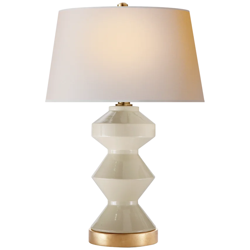 A white ceramic table lamp with a beige base and a white lampshade.